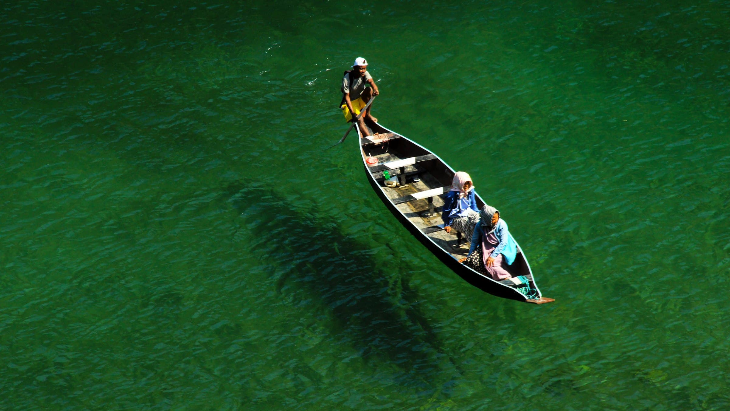 A boat crossing the crystal-clear Umngot river at Dawki, near the Bangladesh border.