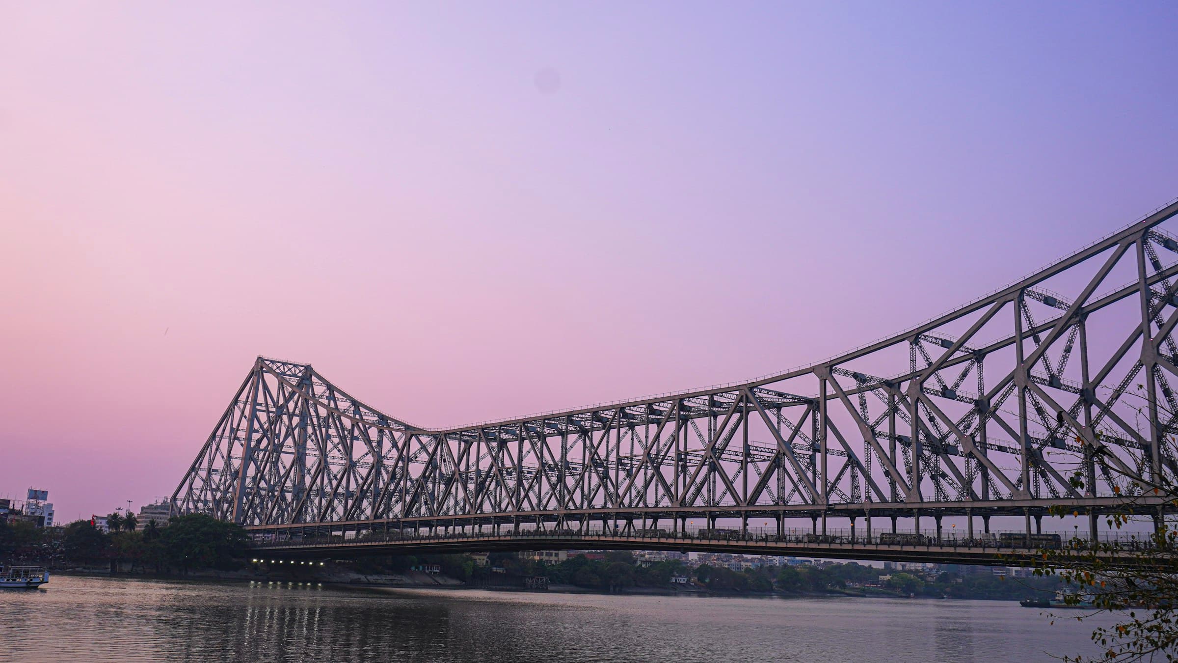 Howrah Bridge over the Hooghly River in Kolkata at dusk