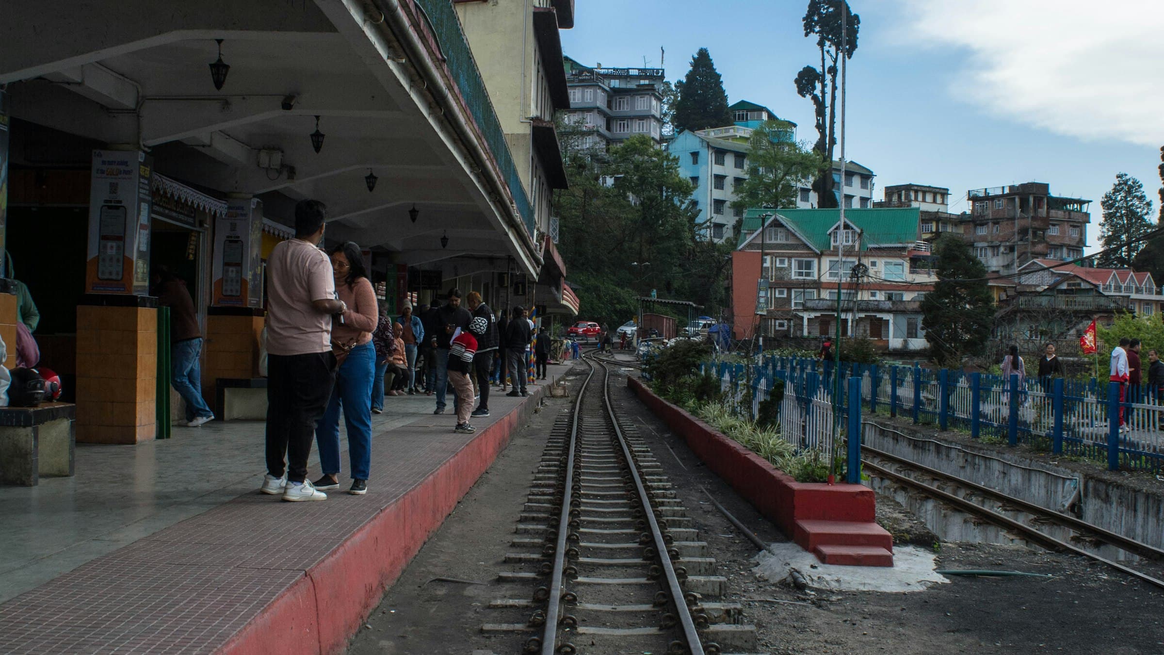 The Darjeeling Himalayan Railway toy train station platform and narrow-gauge tracks