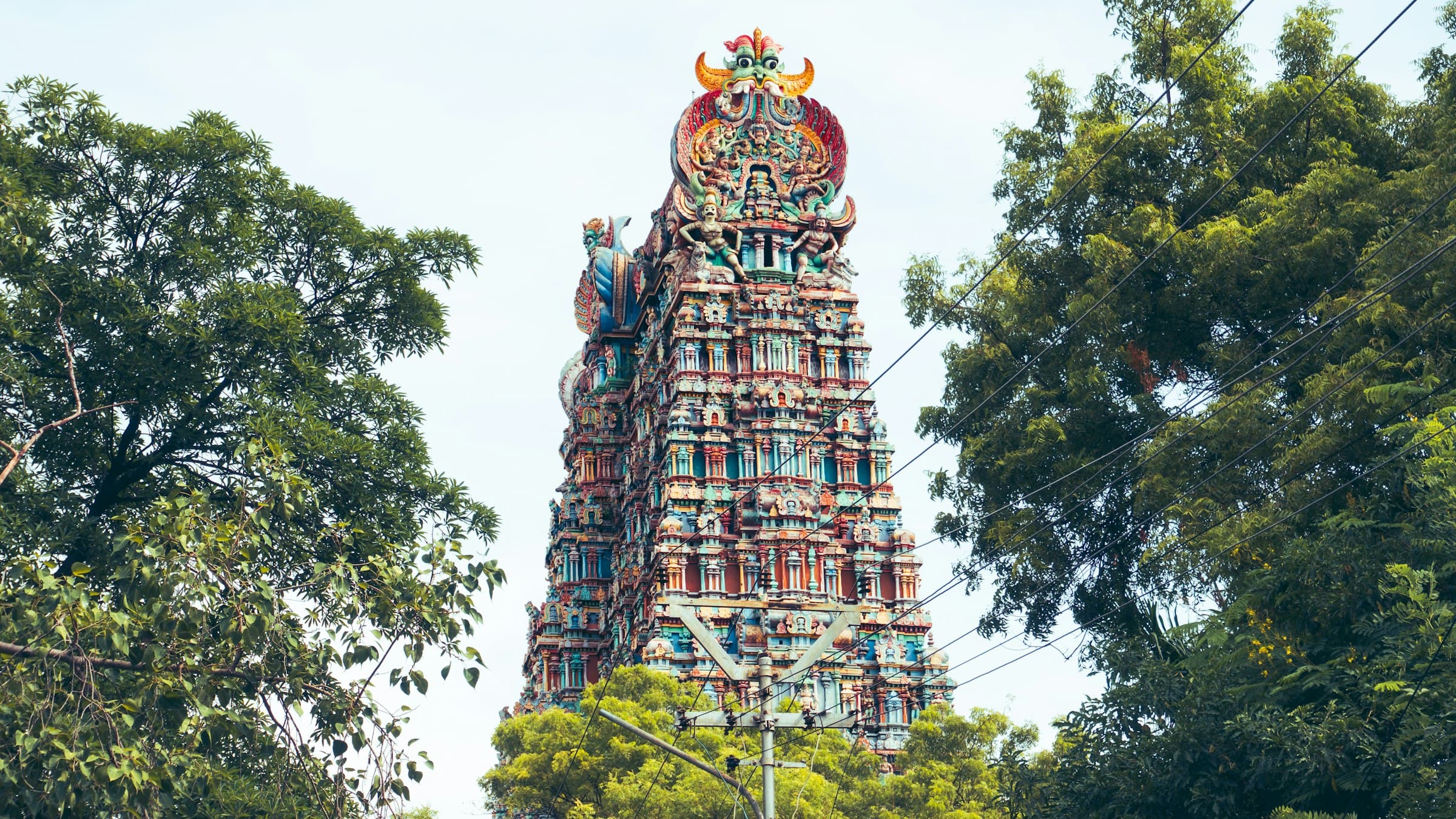 Meenakshi Amman Temple tower in Madurai, Tamil Nadu, covered in carved and painted figures