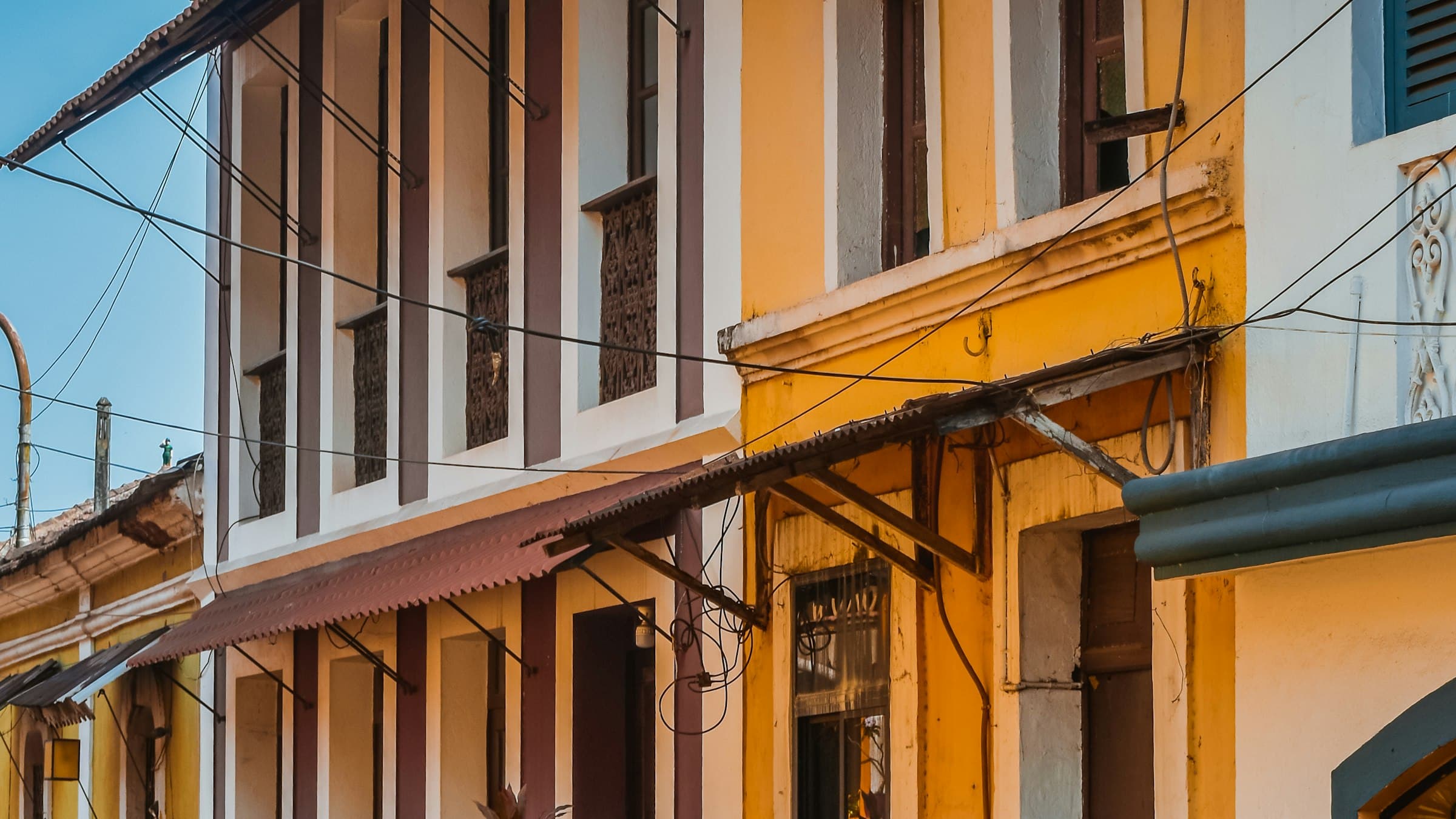 Colorful Portuguese-era houses lining a narrow street in the Fontainhas quarter of Panaji