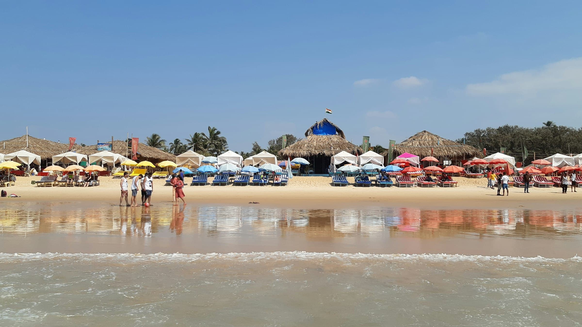 Beach shacks lining the sand at Calangute Beach, Goa