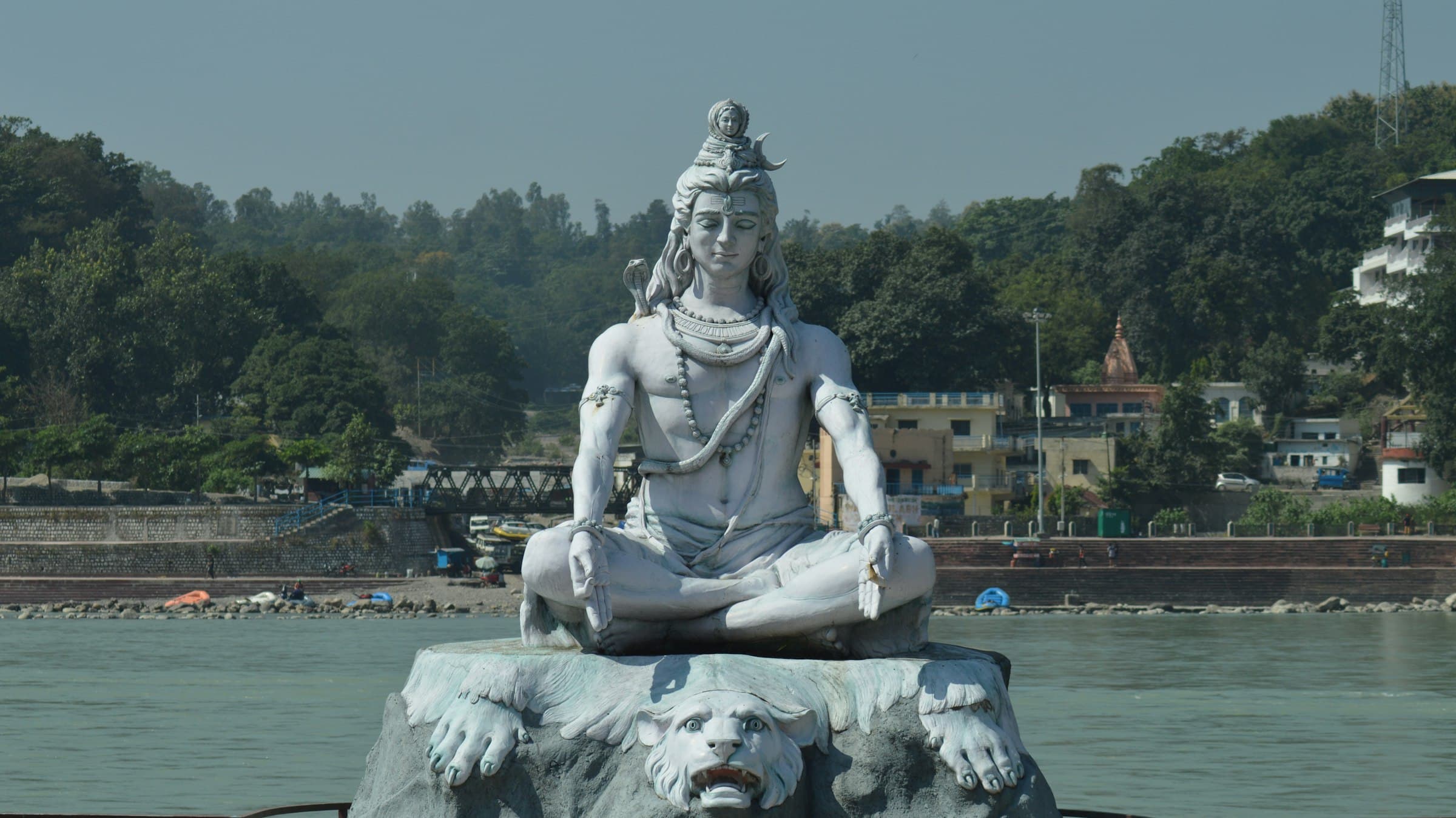 A statue of Shiva in meditation on the banks of the Ganges at Rishikesh.