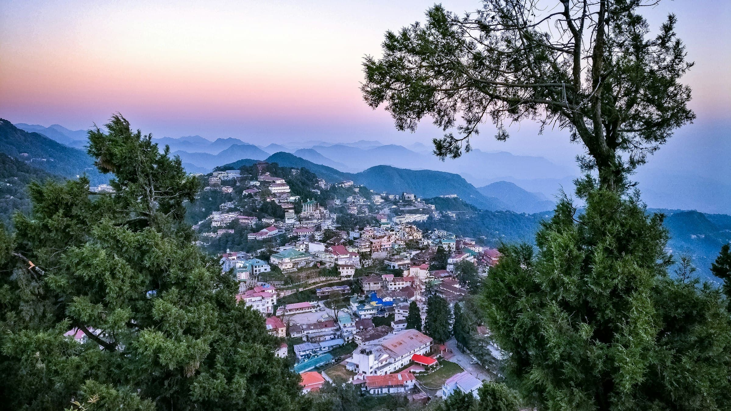 An aerial view over Mussoorie, the old British-era hill station on a ridge above the Doon valley.