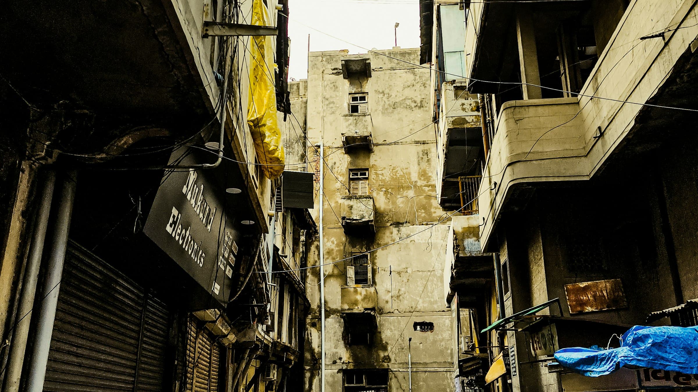 Narrow lane in Ahmedabad's old walled city lined with carved wooden buildings