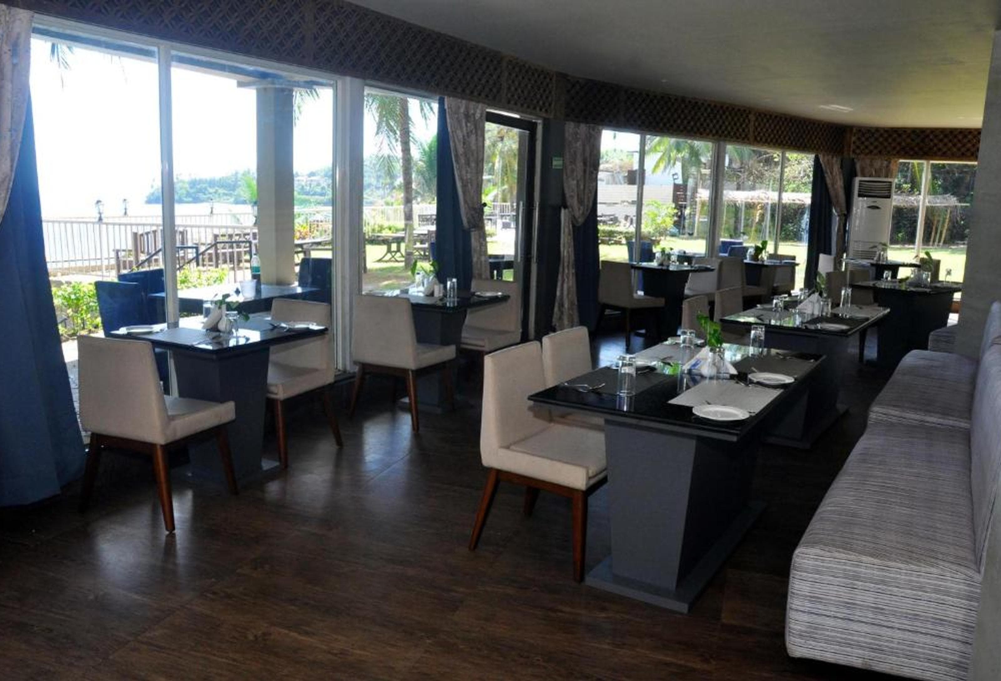 Seaside dining deck at The Bayview restaurant, Sinclairs Bayview Port Blair, with views over the Bay of Bengal