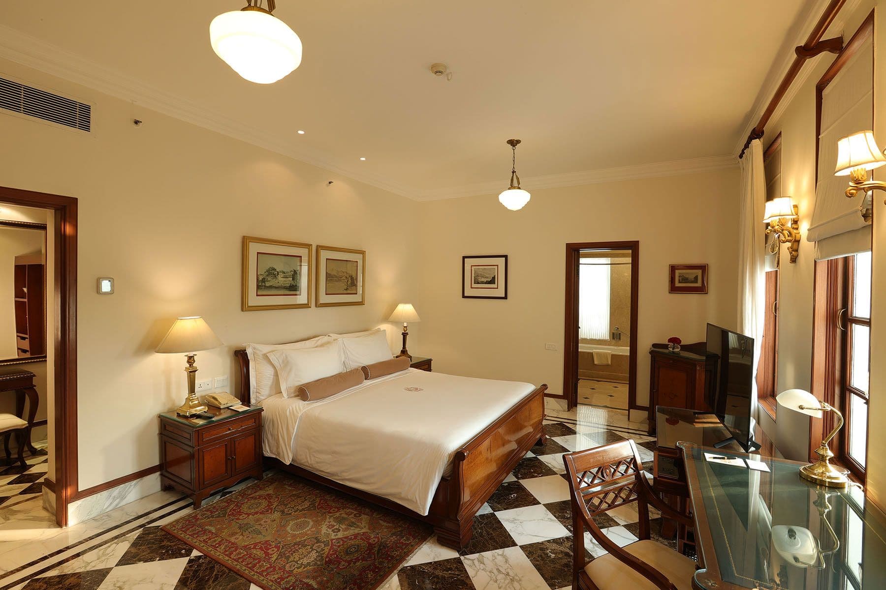 A Heritage Room at The Imperial New Delhi with its separate seating area and marble flooring