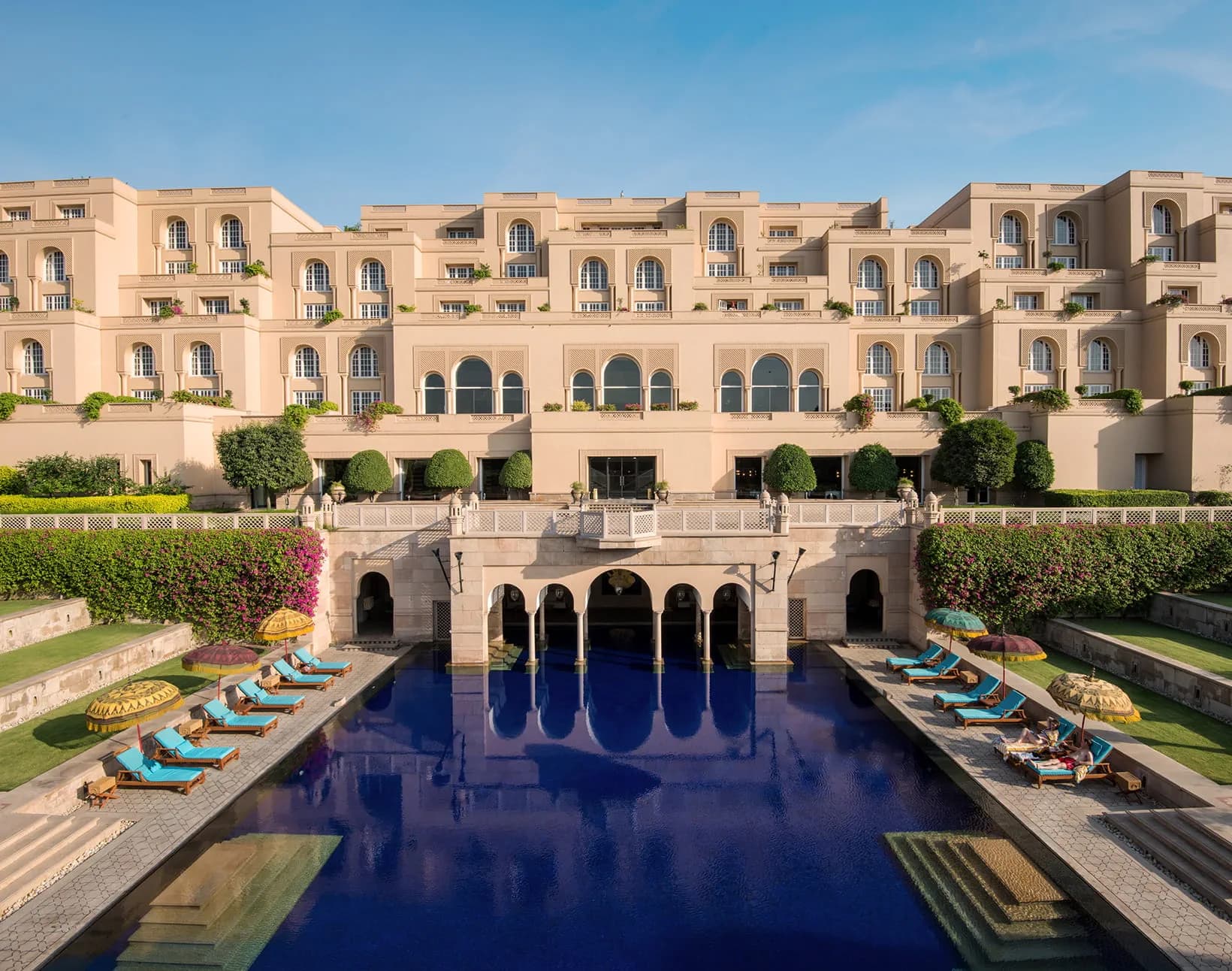 The Oberoi Amarvilas's terraced reflecting pool and domed pavilion entrance at sunrise