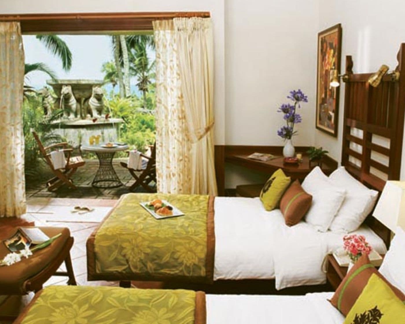 Garden-view room with heritage wooden furniture at Taj Green Cove Resort & Spa, Kovalam