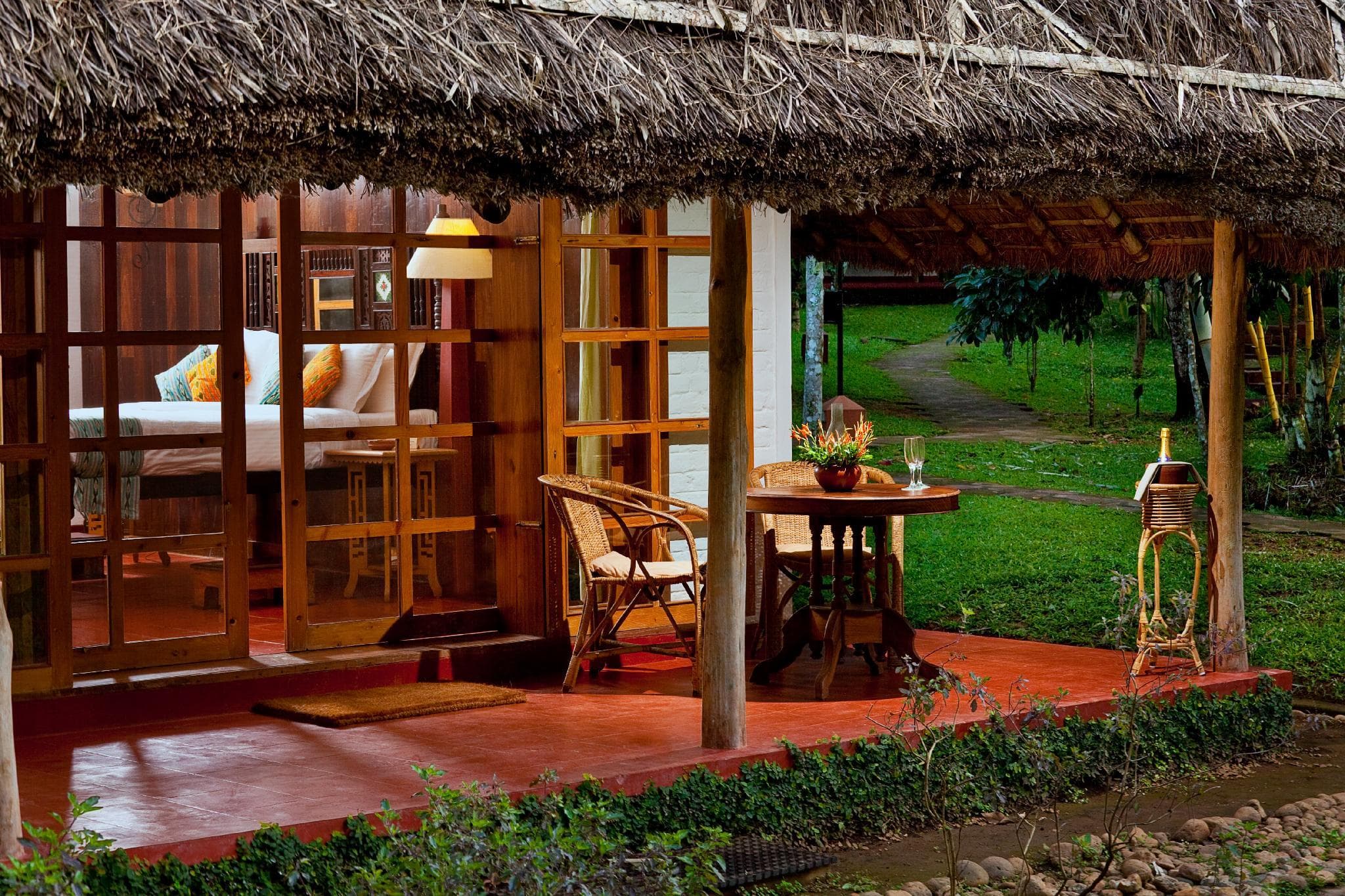Deluxe Cottage private garden veranda at Spice Village, CGH Earth, Thekkady