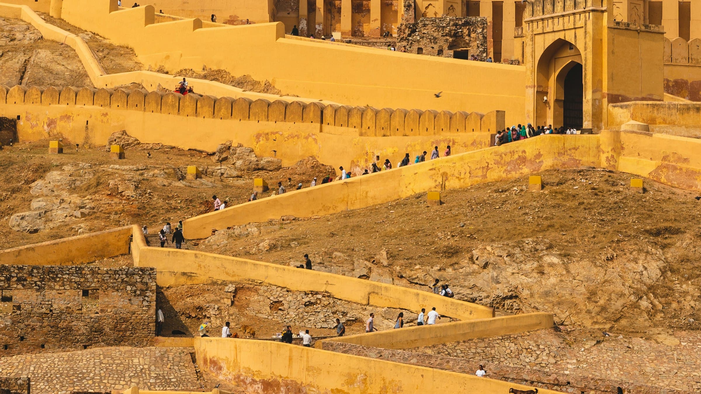 Amber Fort glowing at golden hour above its hillside in Jaipur, Rajasthan
