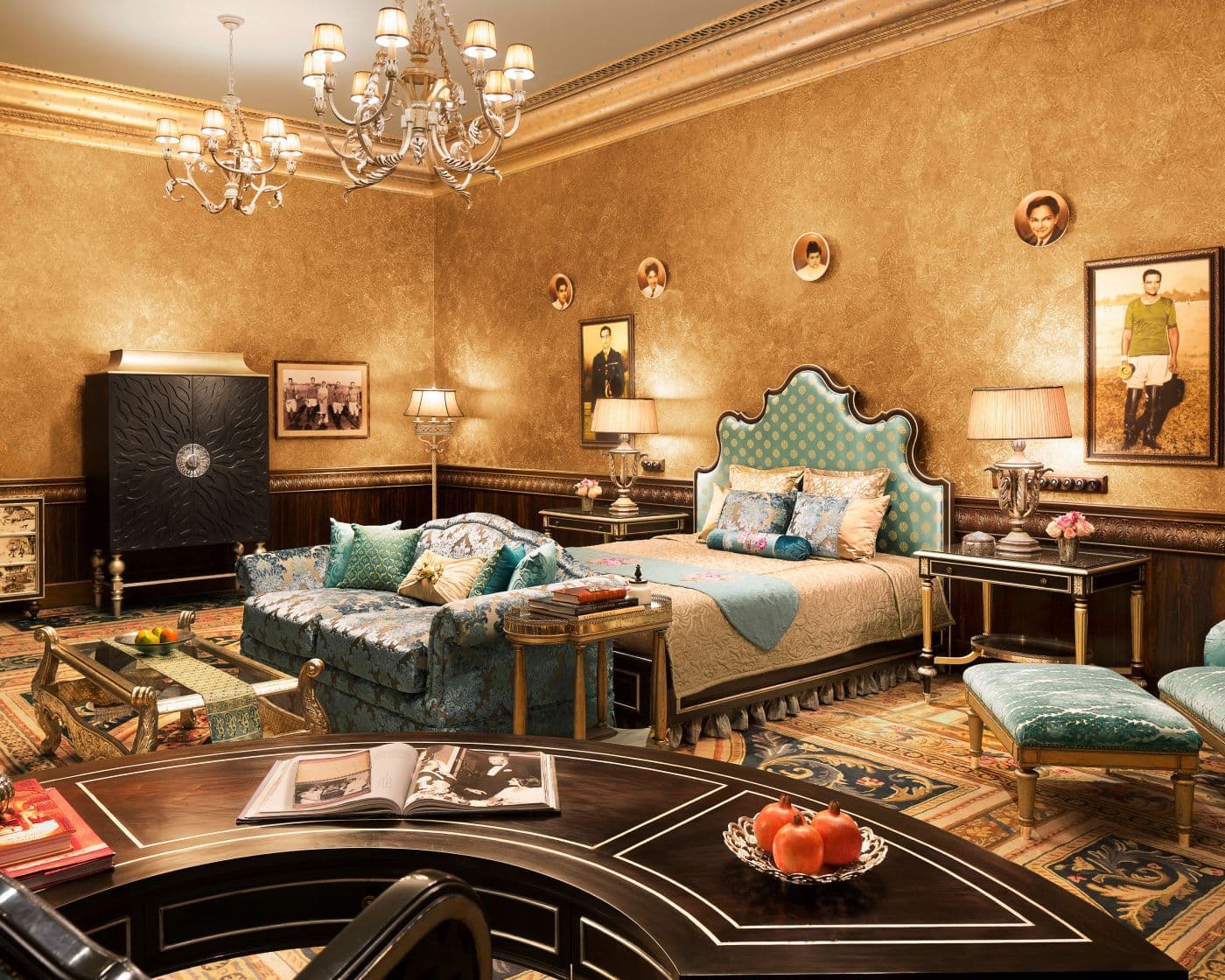 A Royal Suite at Rambagh Palace, Jaipur, with a canopied bed, painted ceiling and period furniture