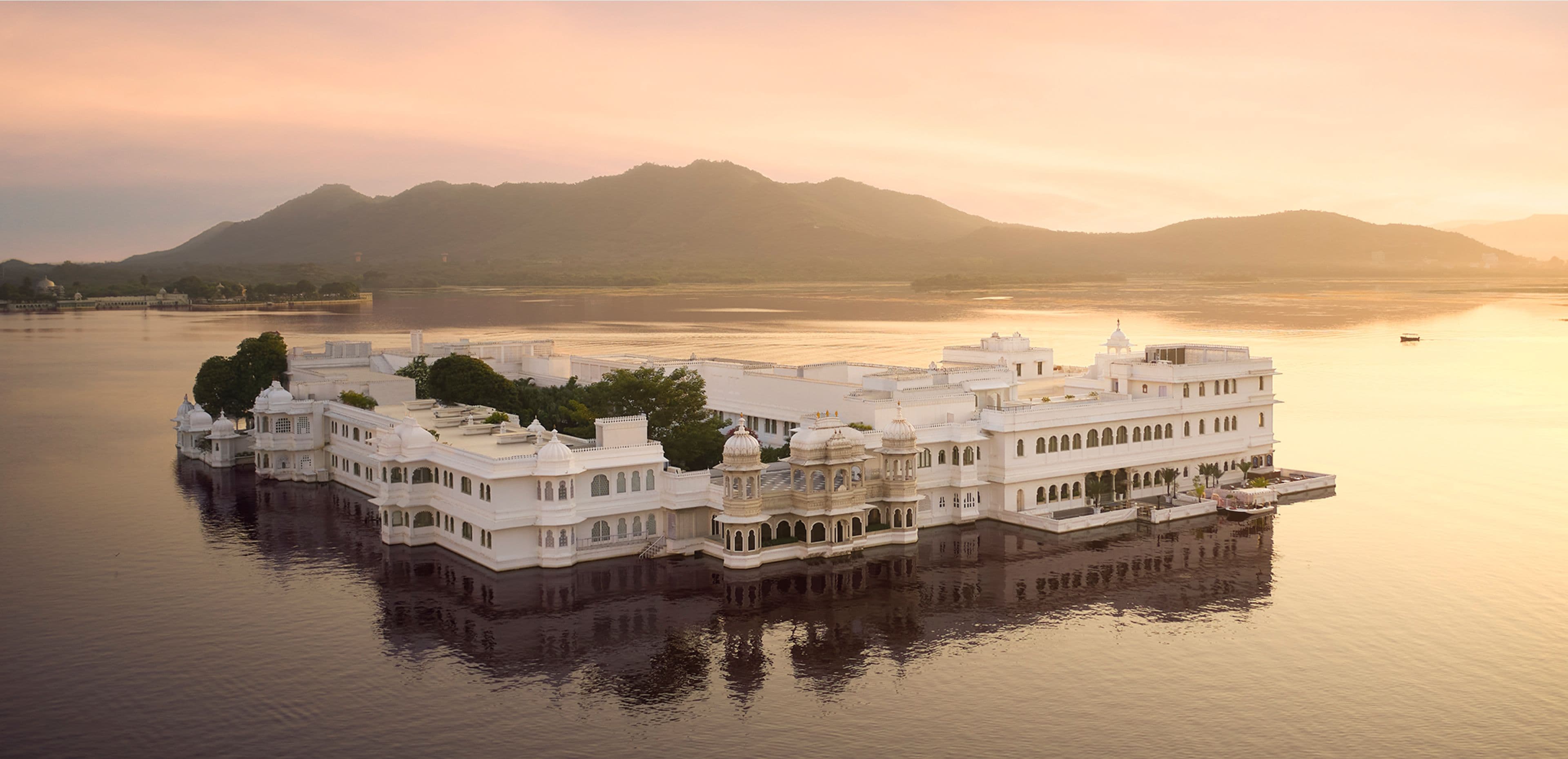 The view from Taj Lake Palace across Lake Pichola towards the Udaipur shoreline and hills