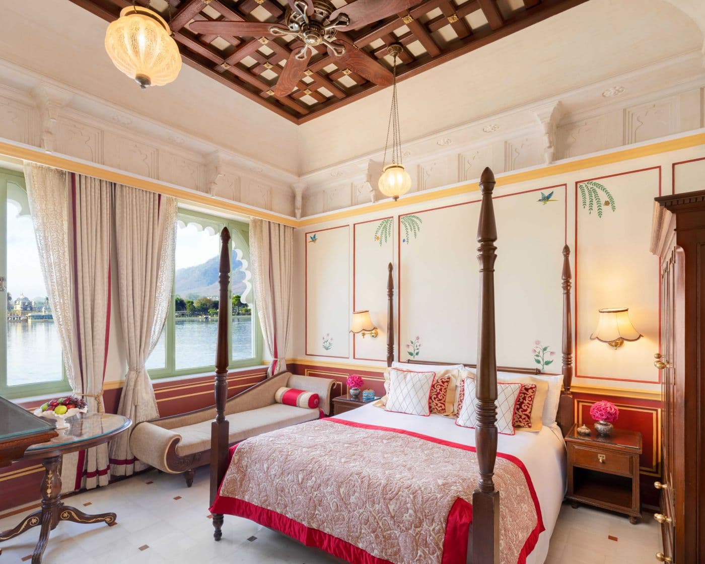 A Luxury Lake View room at Taj Lake Palace, Udaipur, with a double bed facing windows over Lake Pichola