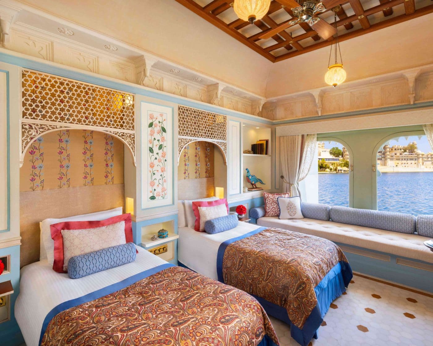 The twin-bed layout of a Palace Room at Taj Lake Palace, Udaipur, with mirrorwork wall panels