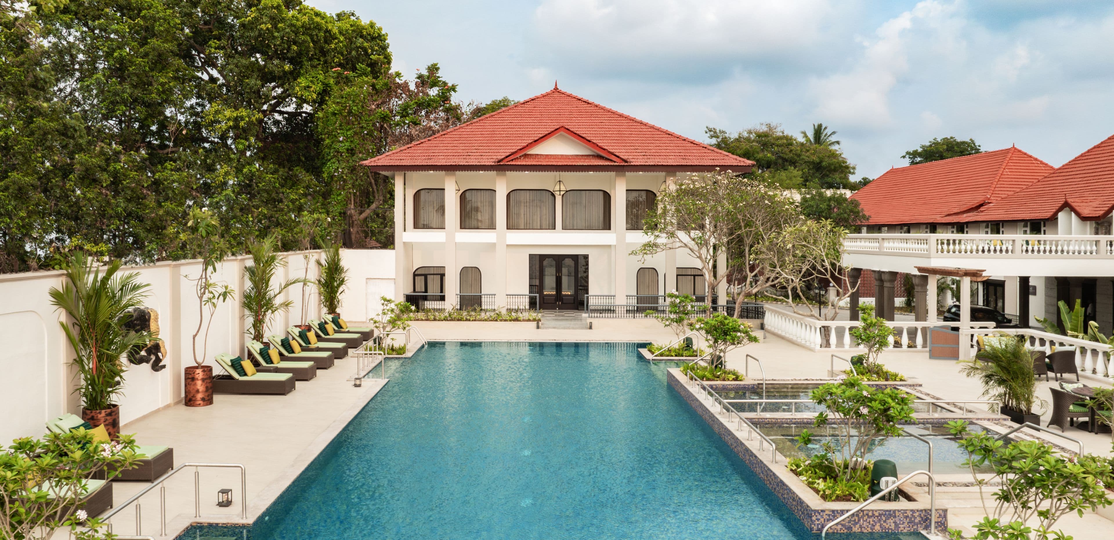 The waterfront pool at Taj Malabar, Cochin, beside the red-tiled colonial wing of the resort