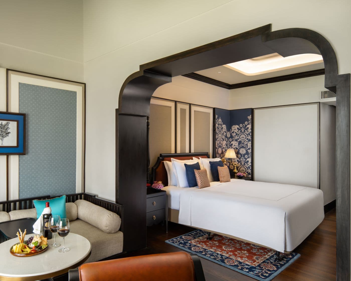 A Heritage Room at Taj Malabar, Cochin, with teak flooring, period furniture and a king bed