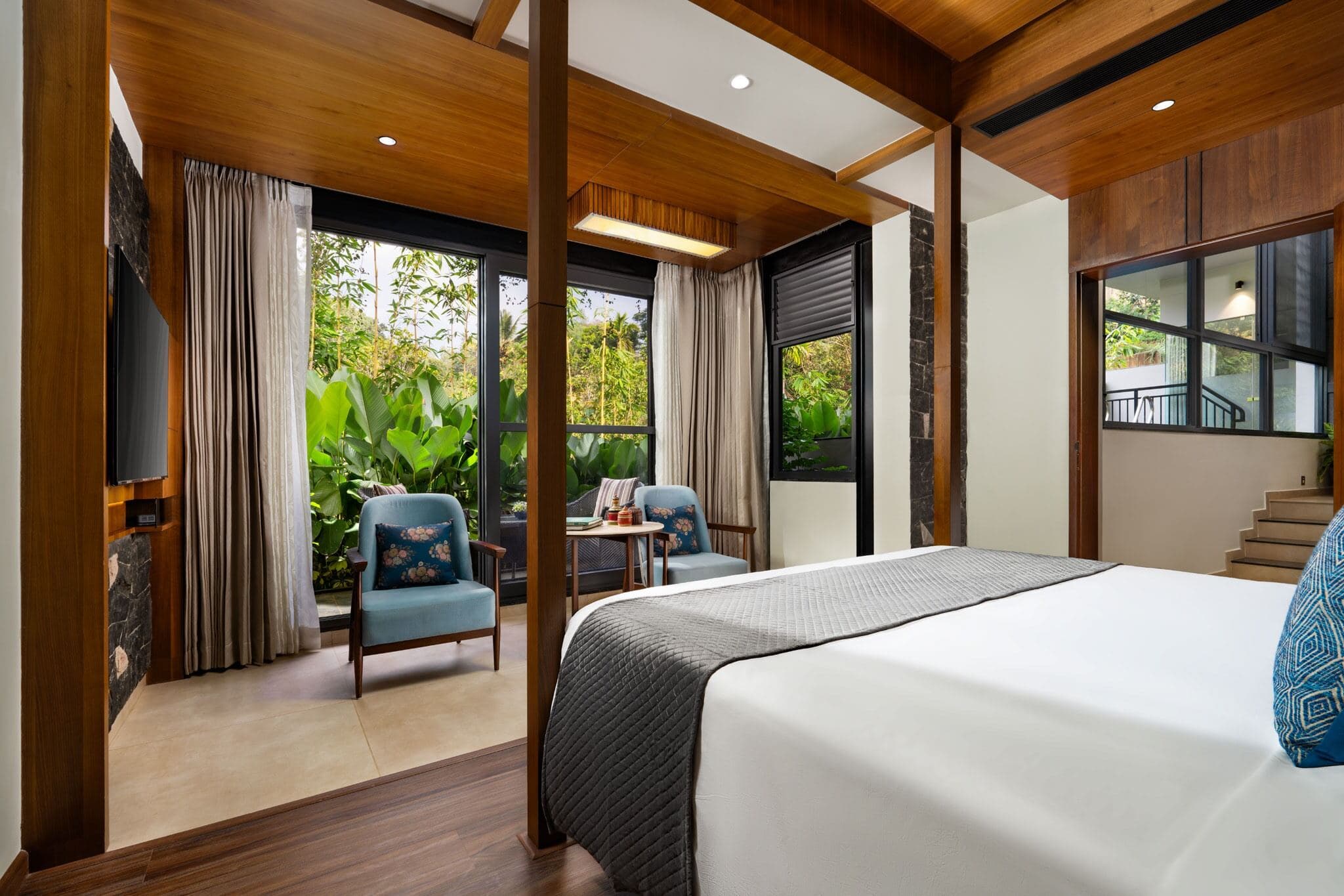 A Premium Honeymoon Room with plunge pool at Scenic, Munnar, opening onto a private deck