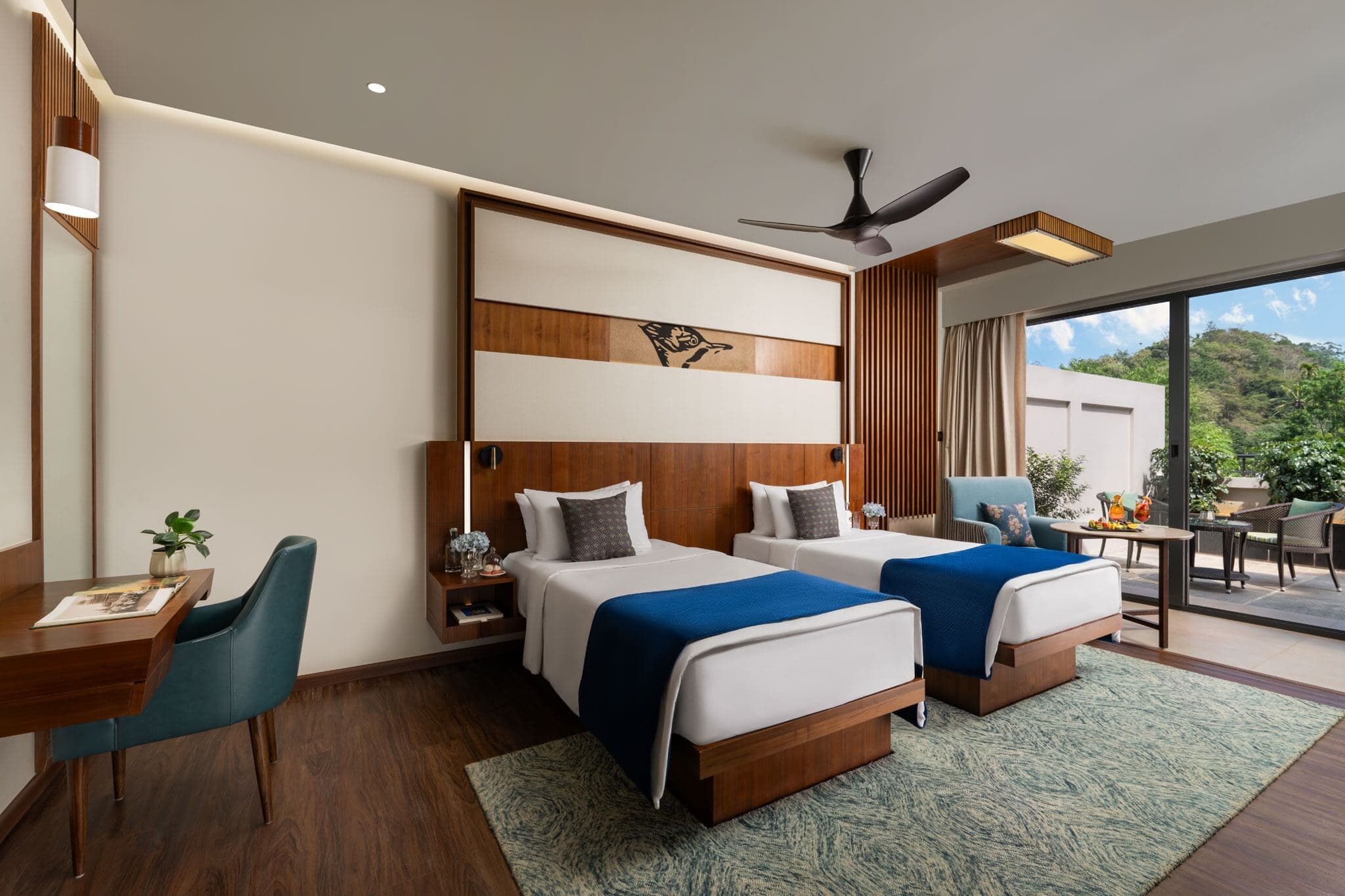 A Premium Room with Balcony at Scenic, Munnar, in a twin-bed layout facing the tea gardens