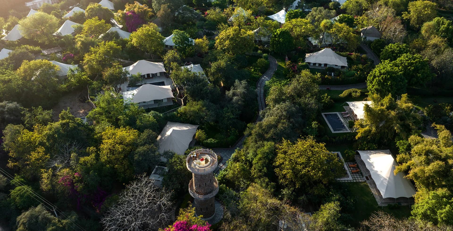 The Oberoi Vanyavilas seen from above, its tents set among gardens beside the Ranthambore forest
