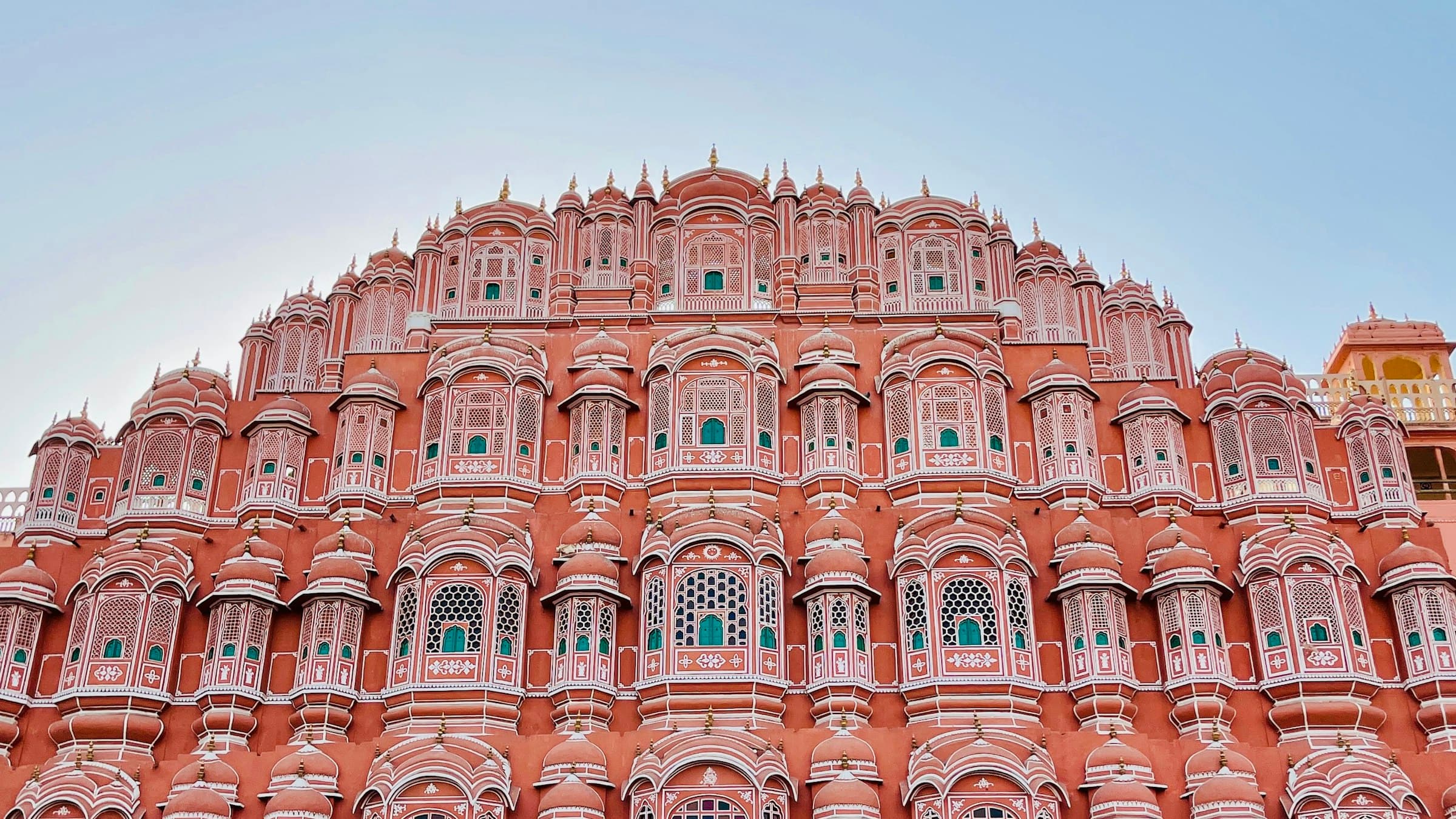 The pink honeycomb facade of Hawa Mahal in Jaipur