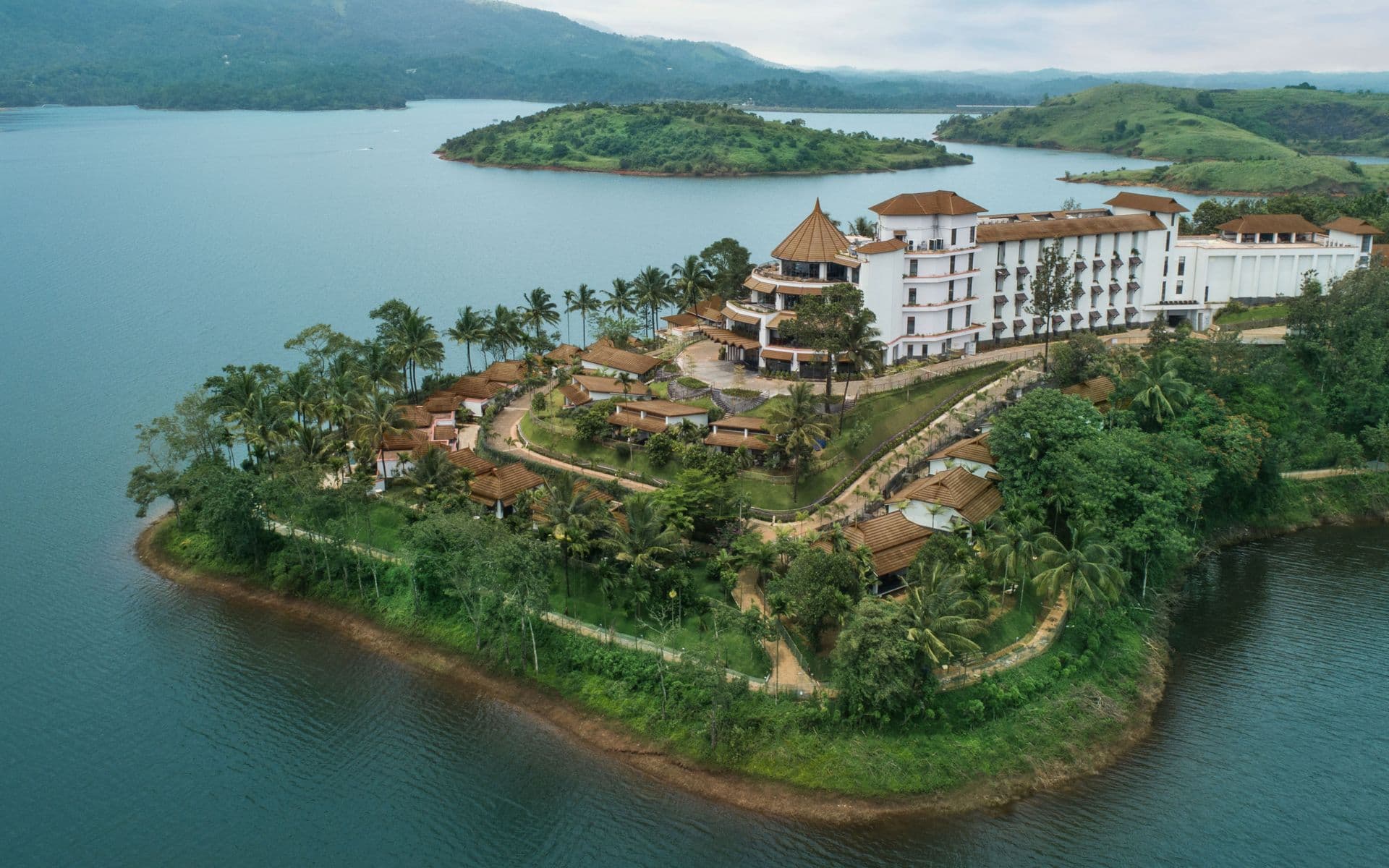Waterfront cottages stepped down the slope at Taj Wayanad Resort & Spa