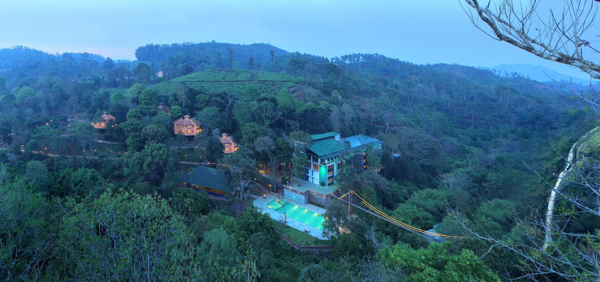 Vythiri Village Resort set among dense rainforest in the Wayanad hills, seen from above