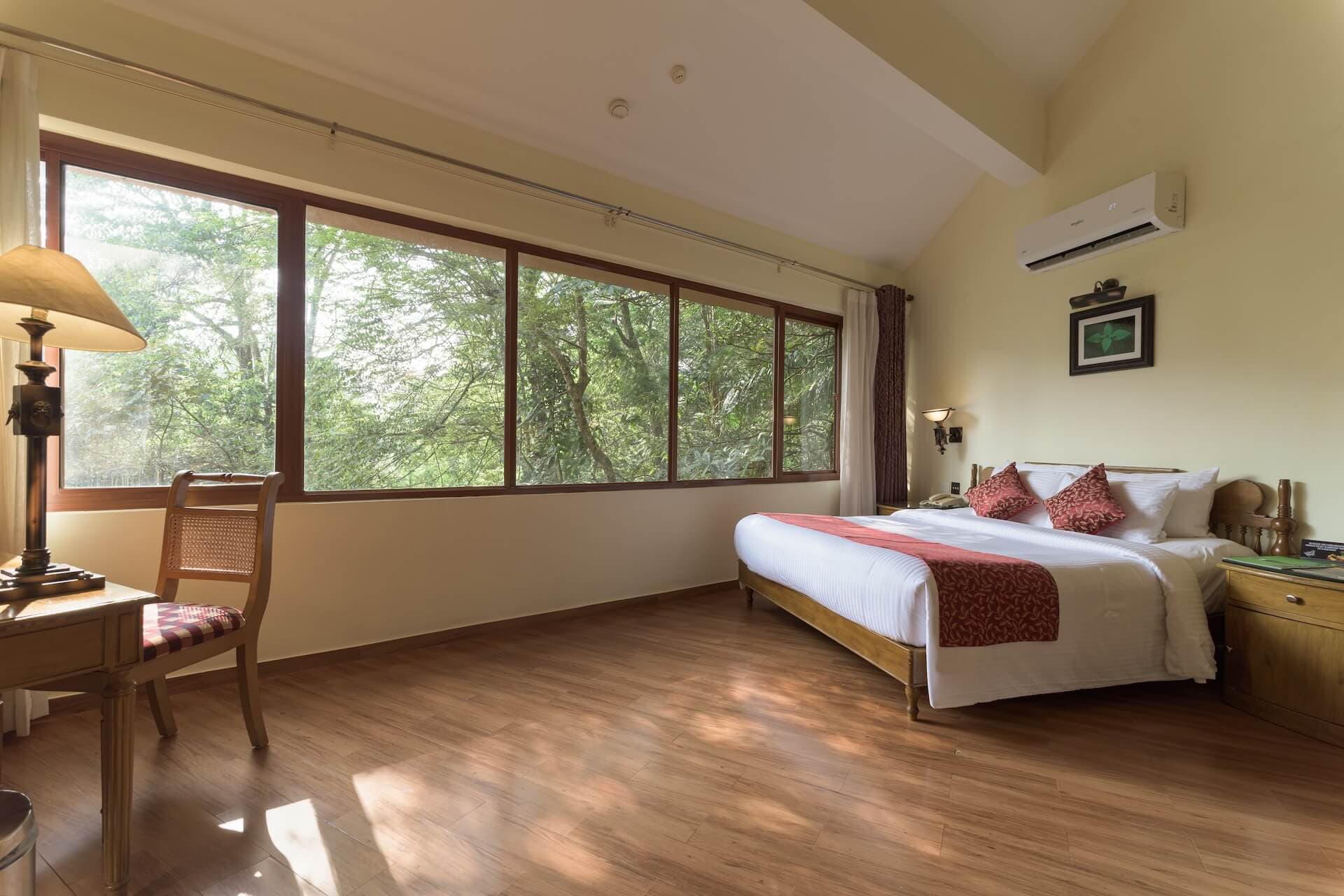 A Kerala-style cottage among the trees at Vythiri Village Resort
