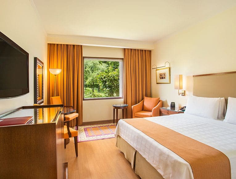 A Deluxe Garden View Room at Trident Agra