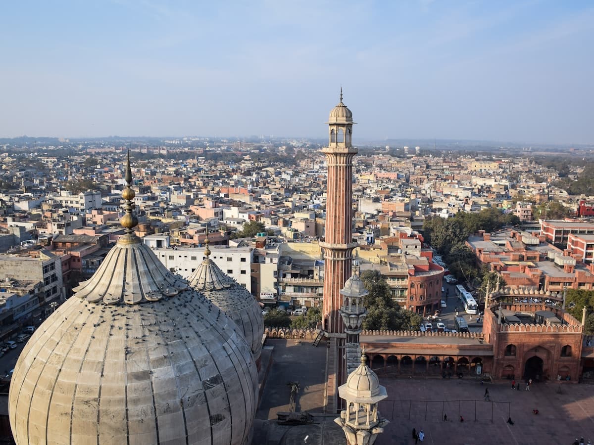 An aerial view over the dense rooftops of Old Delhi