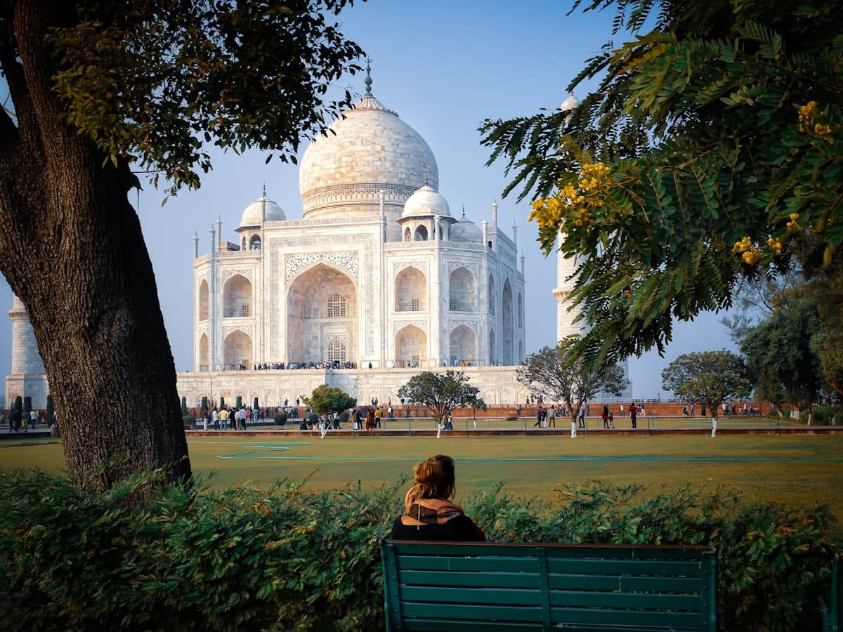The Taj Mahal seen across the gardens from within the Agra grounds