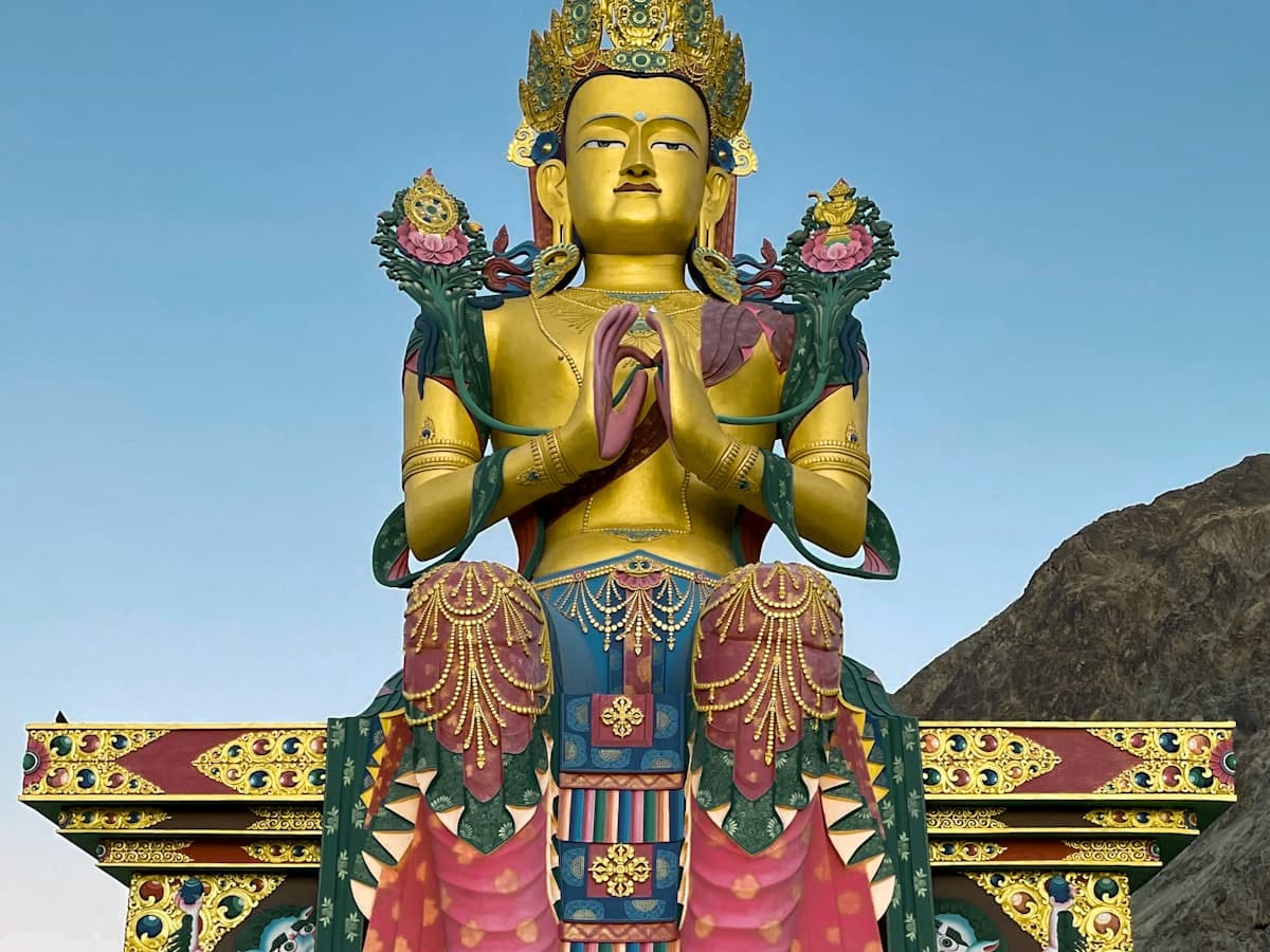 The 32-metre gilded Maitreya Buddha statue below Diskit Monastery, gazing down the Shyok Valley in Ladakh's Nubra region.