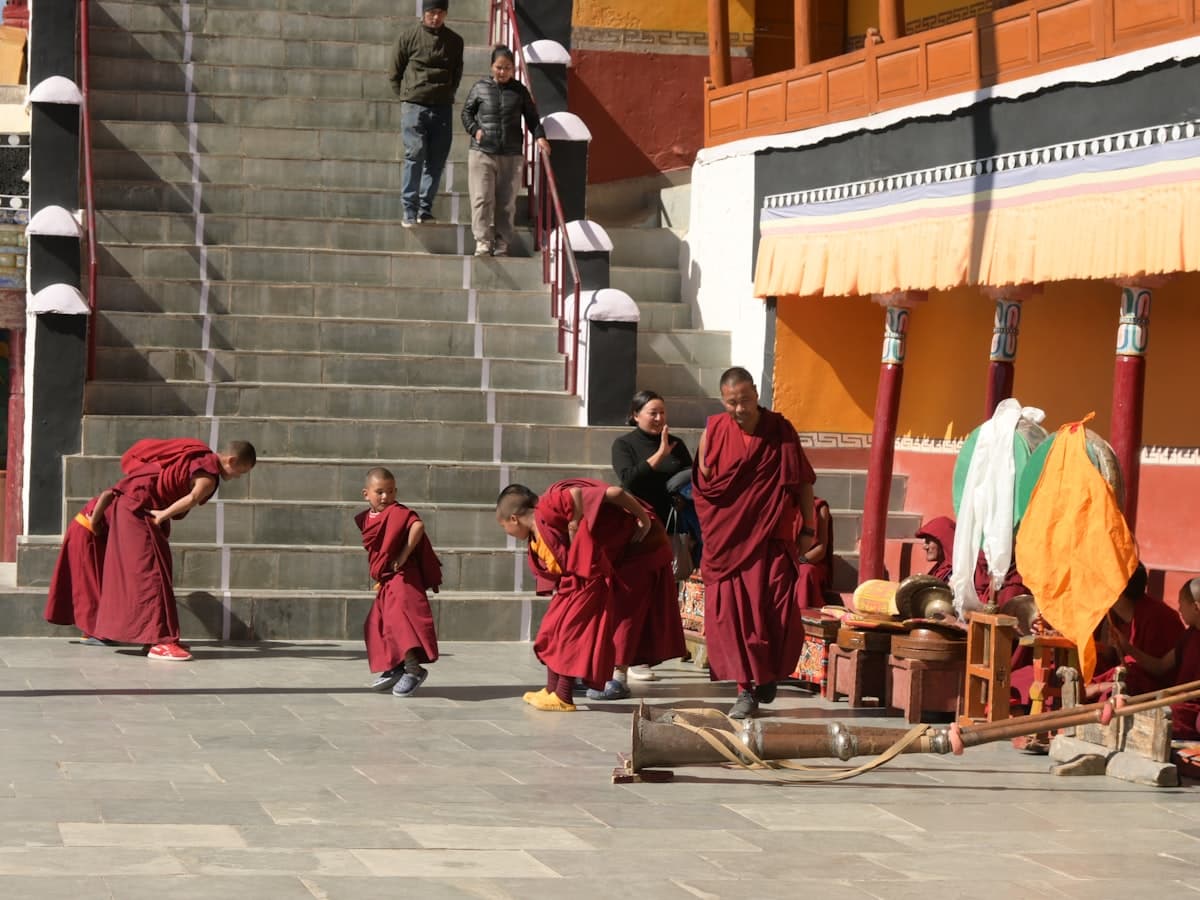 Monks moving through Thiksey Monastery during a morning ritual, the daily prayer cycle that opens the day in Ladakh's Gelugpa gompas.