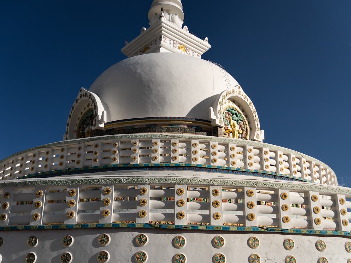 The white dome of Shanti Stupa on its hilltop above Leh, the old town and bare ridges falling away below