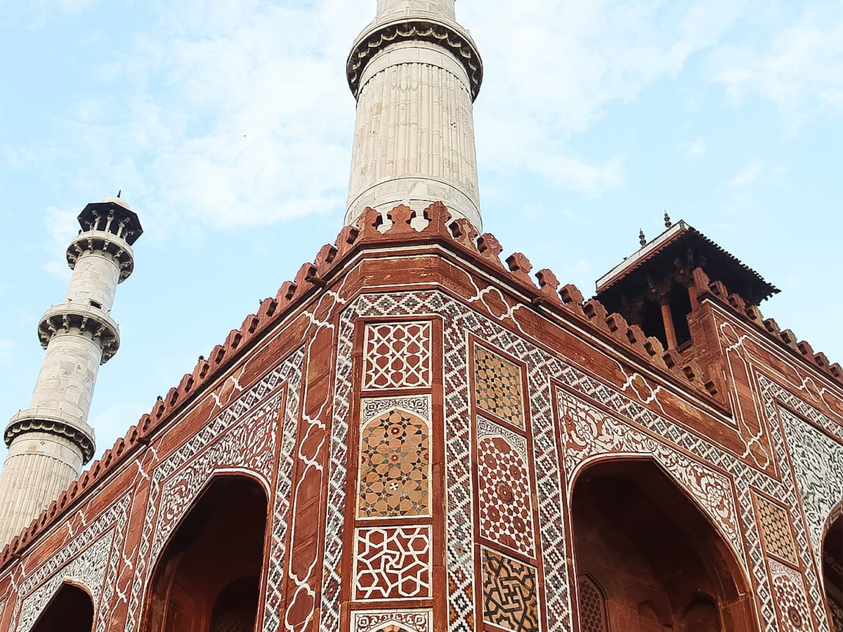 The red-sandstone gateway and tomb building of Akbar the Great's mausoleum at Sikandra, on the outskirts of Agra.