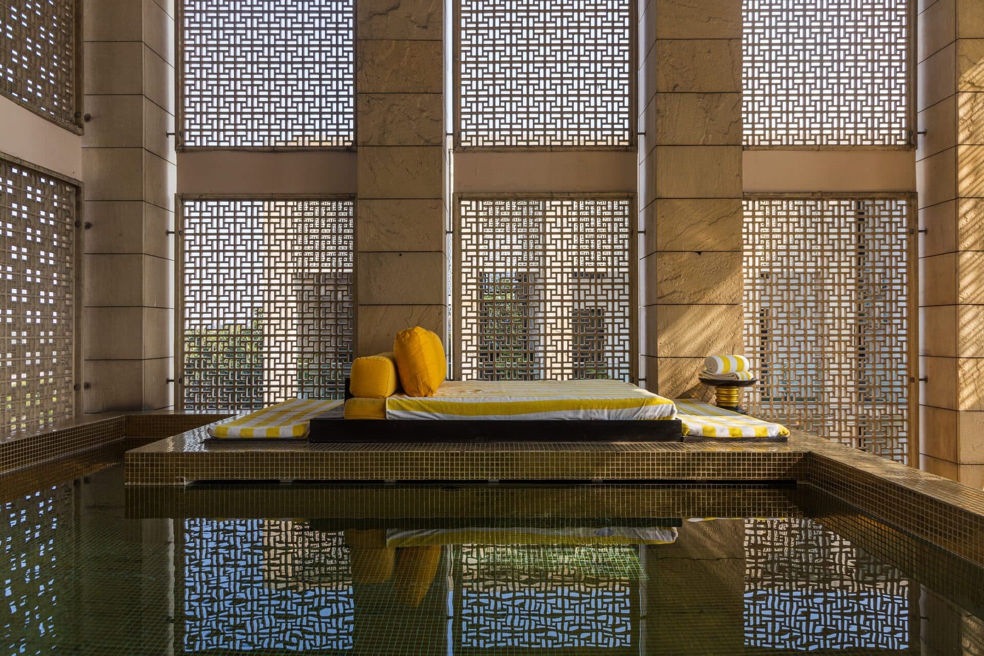 The main outdoor swimming pool and lawns at The Lodhi, New Delhi