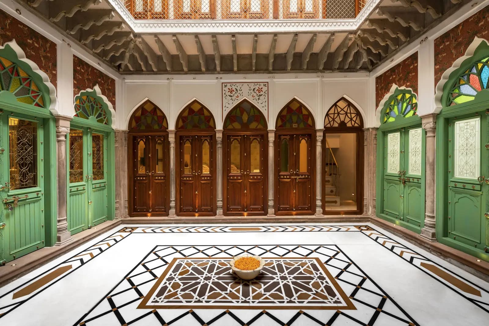 The arched, carved central courtyard of Haveli Dharampura, Old Delhi