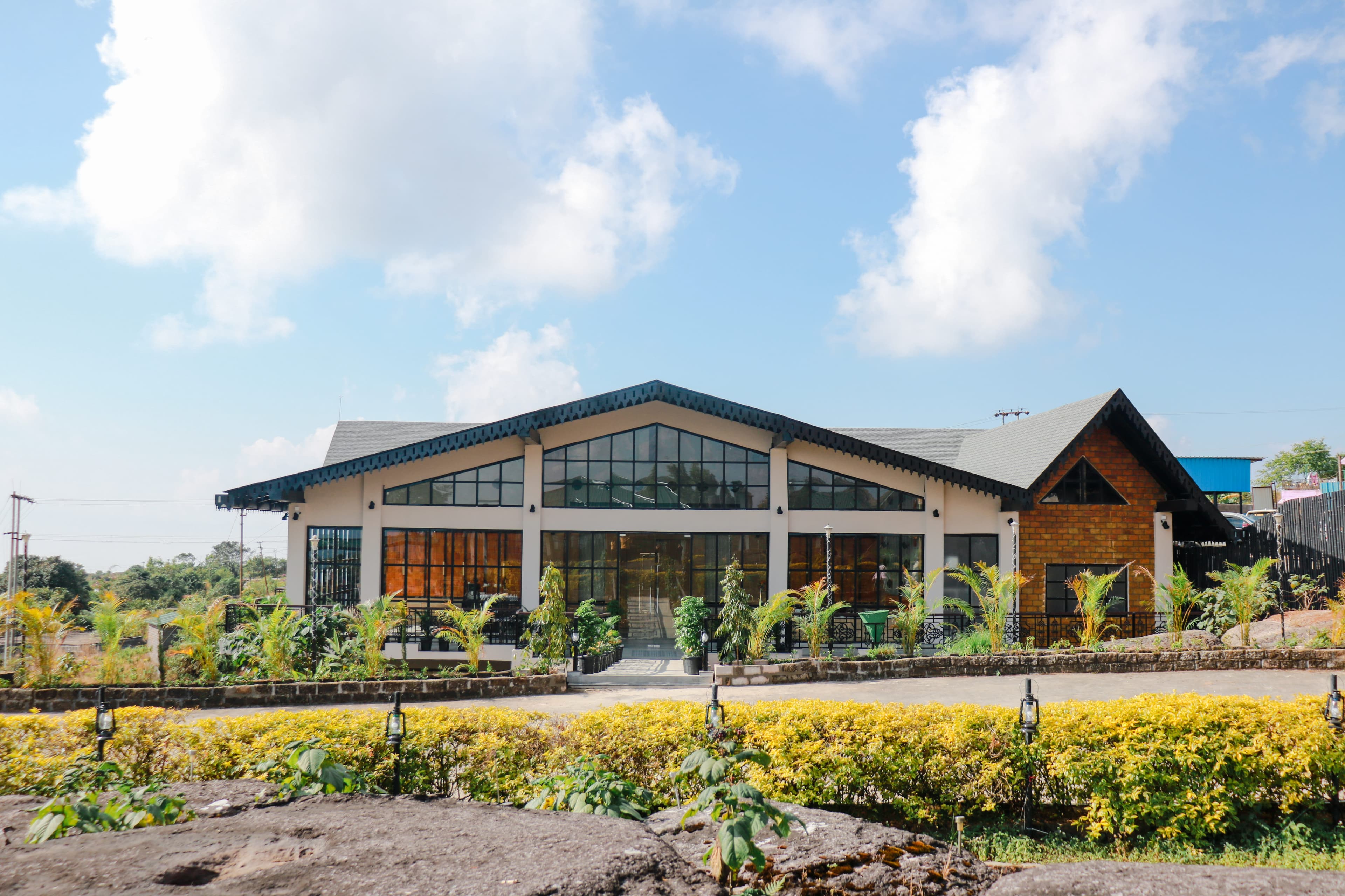 The main building of Polo Orchid Resort, Cherrapunji seen across its landscaped clifftop garden.