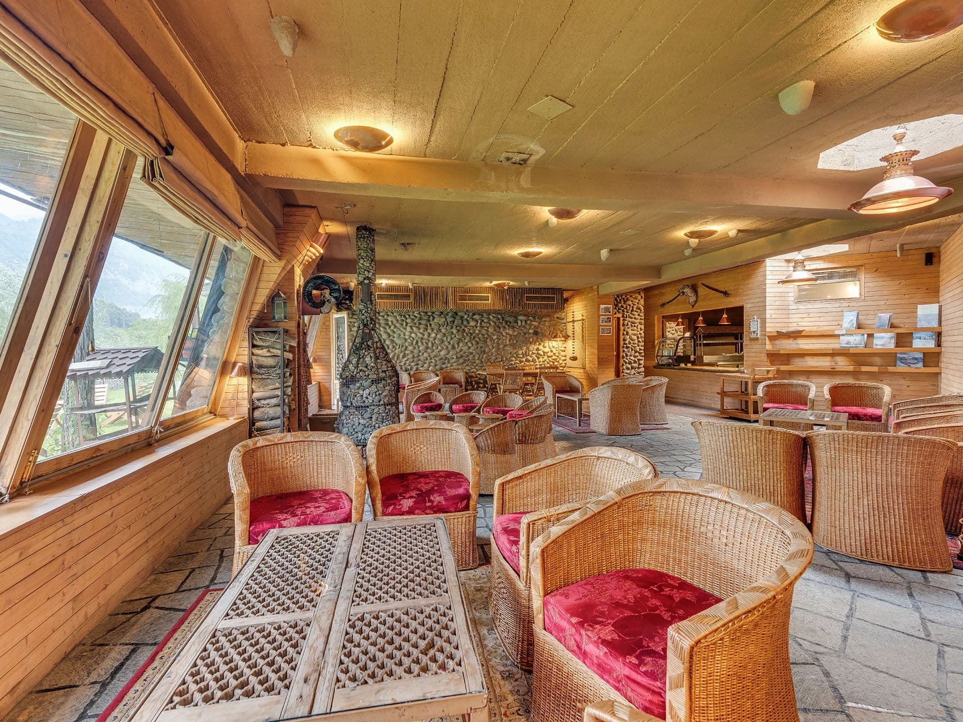 The Stone Age Lounge bar and seating area at Pahalgam Hotel.
