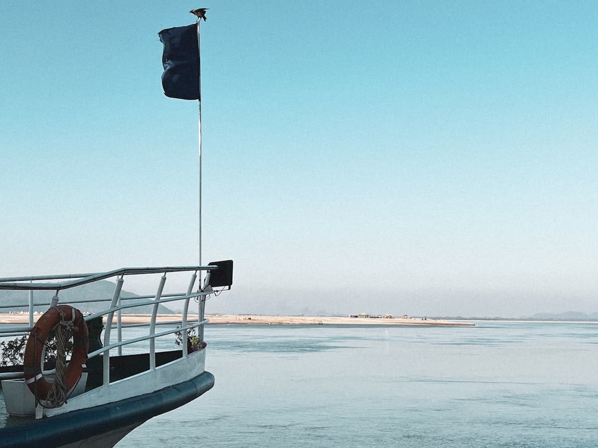 The view from the bow of a boat cruising down the wide Brahmaputra River at Guwahati.