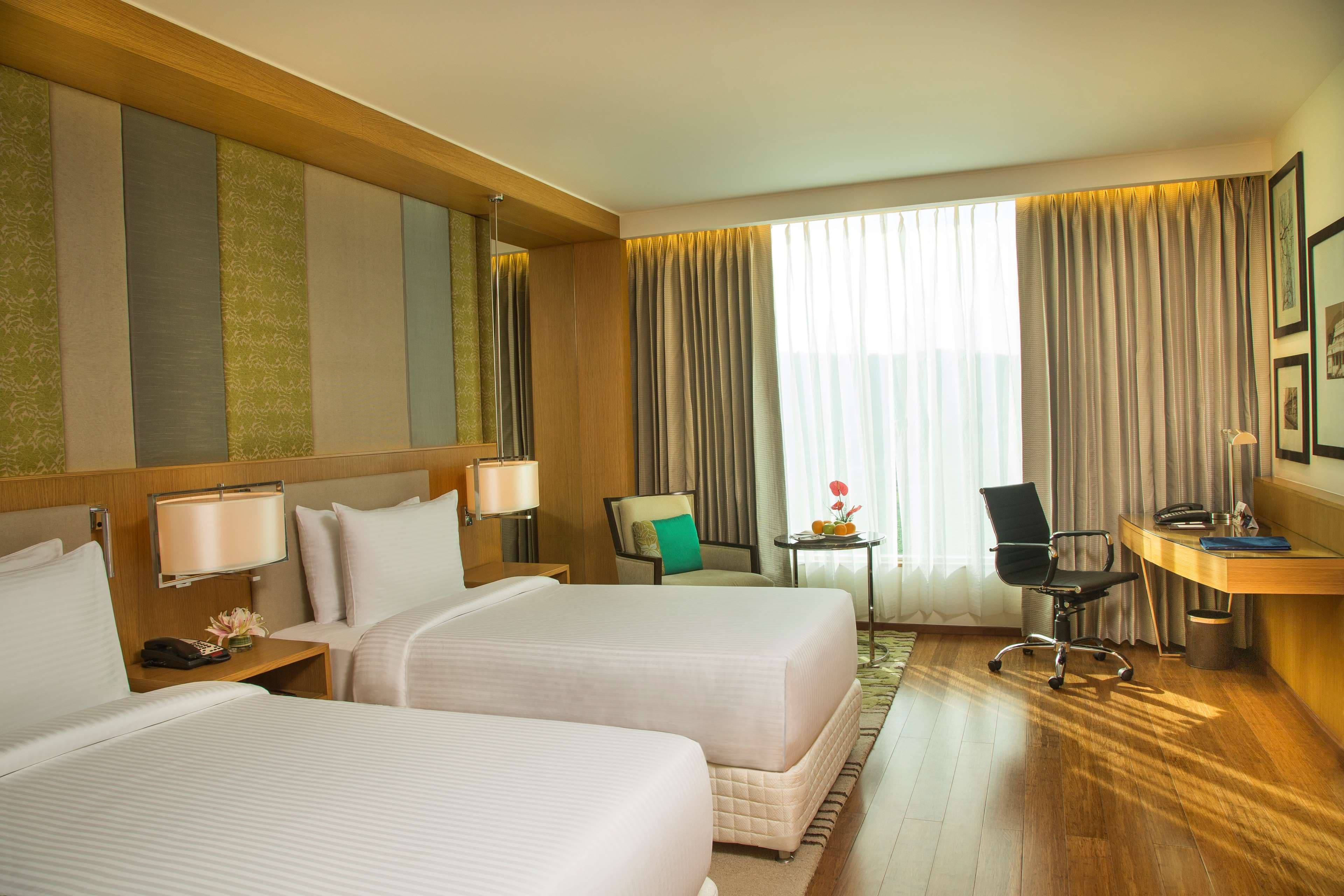 A guest room with a king bed at Radisson Blu Hotel Guwahati.