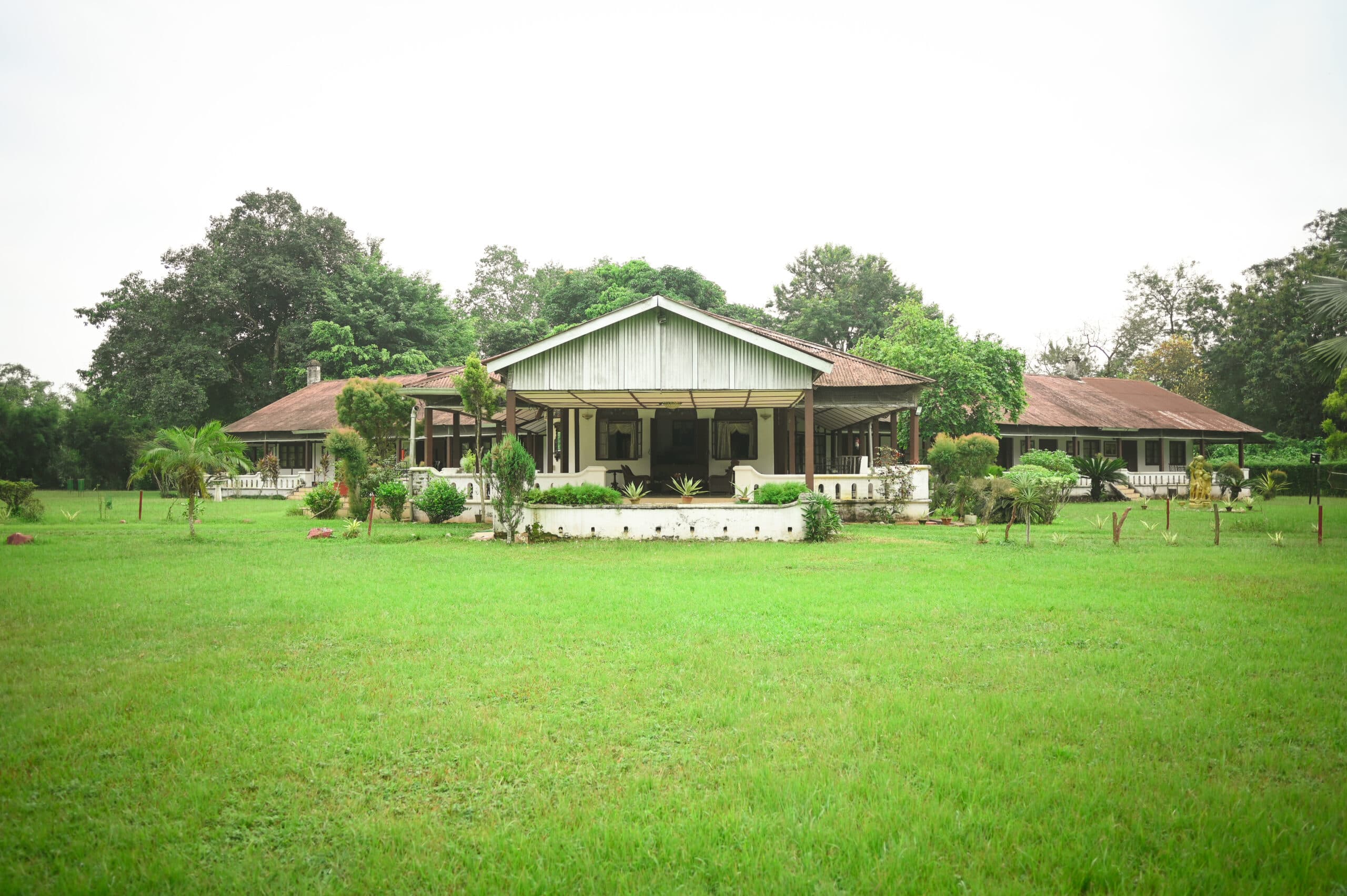 The colonial tea bungalow of Banyan Grove on the Gatoonga Tea Estate, Jorhat, seen across its lawn.