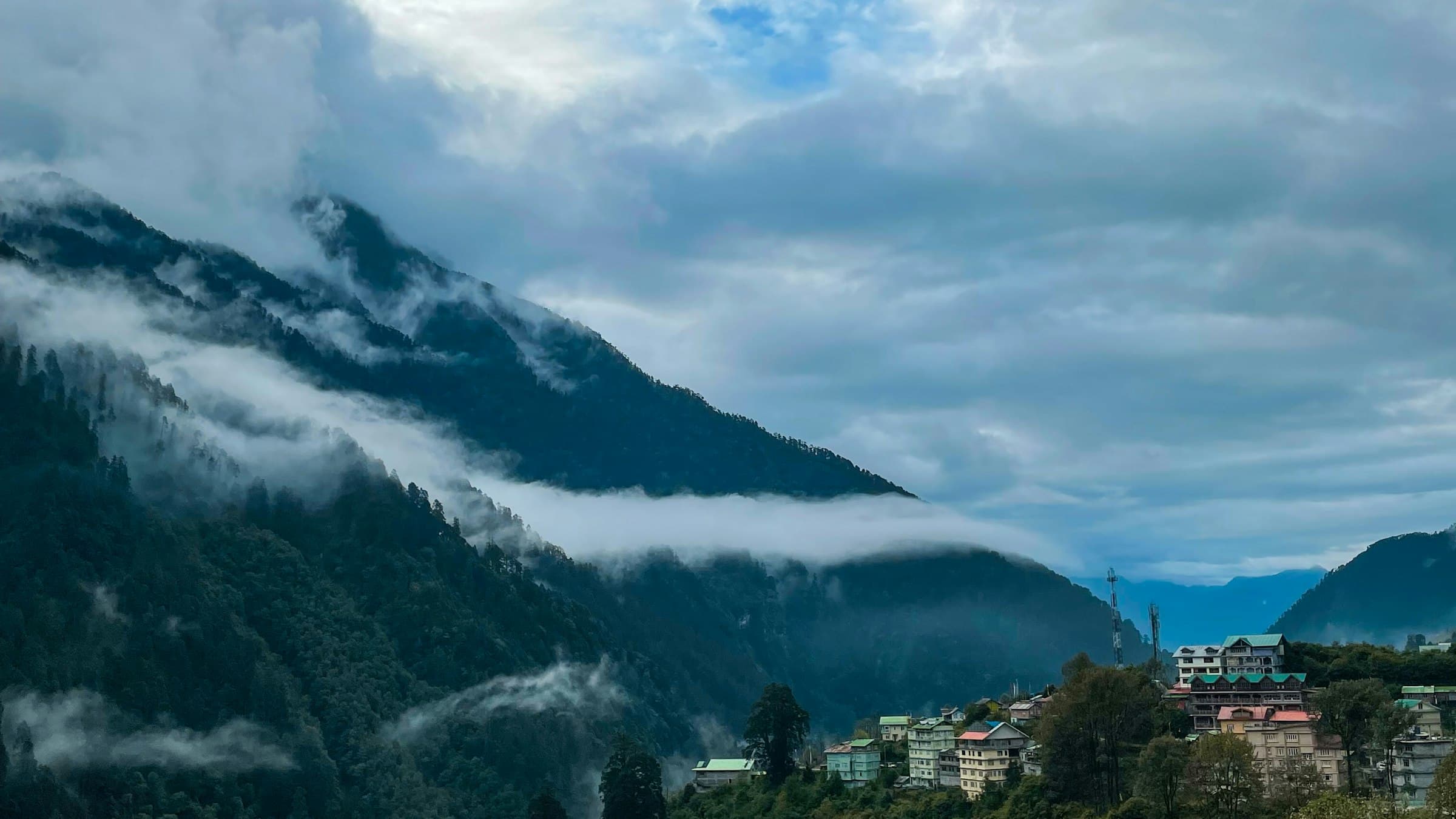 The mountain town of Lachen in North Sikkim nestled among cloud-wrapped green ridges.