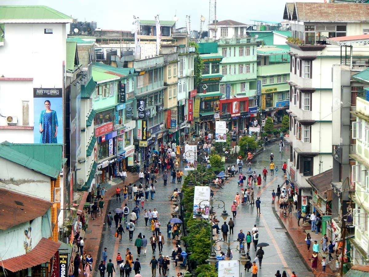 A crowded pedestrian street lined with buildings in Gangtok, Sikkim.
