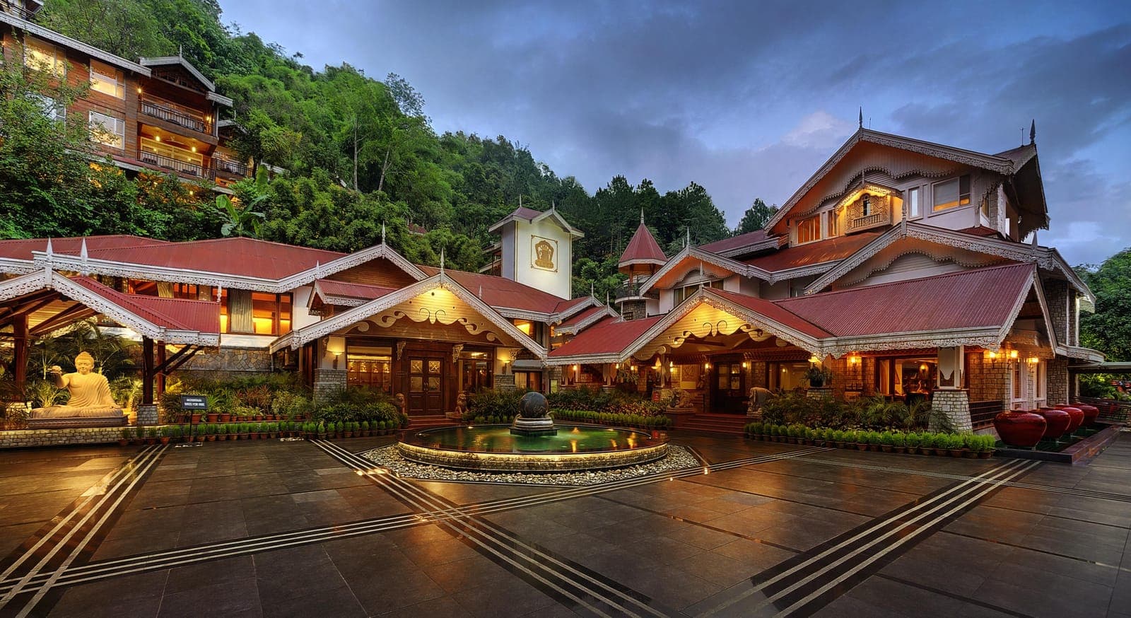 The illuminated facade of MAYFAIR Spa Resort & Casino, Gangtok, after dark.