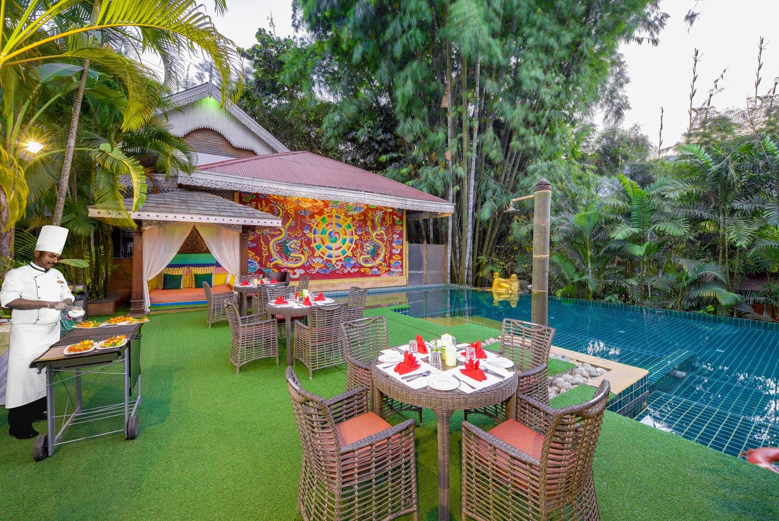 The outdoor pool and seating terrace at MAYFAIR Spa Resort & Casino, Gangtok.