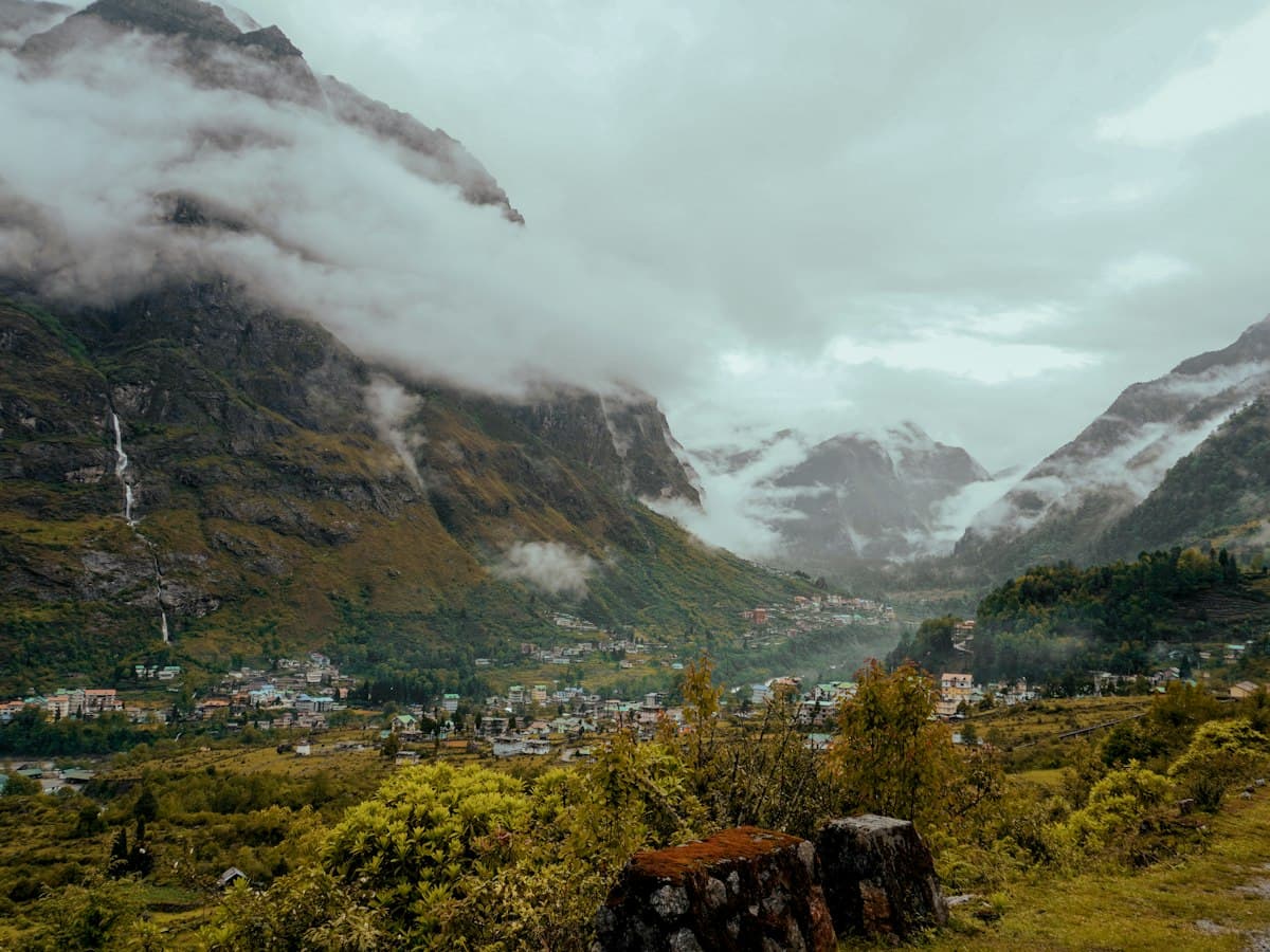 A deep green Himalayan valley below high mountains near Lachung, North Sikkim.