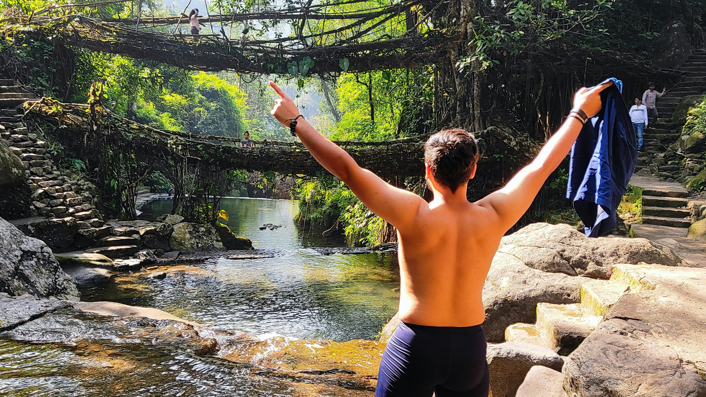 A person stands on the Double Decker Living Root Bridge in Nongriat, Meghalaya.