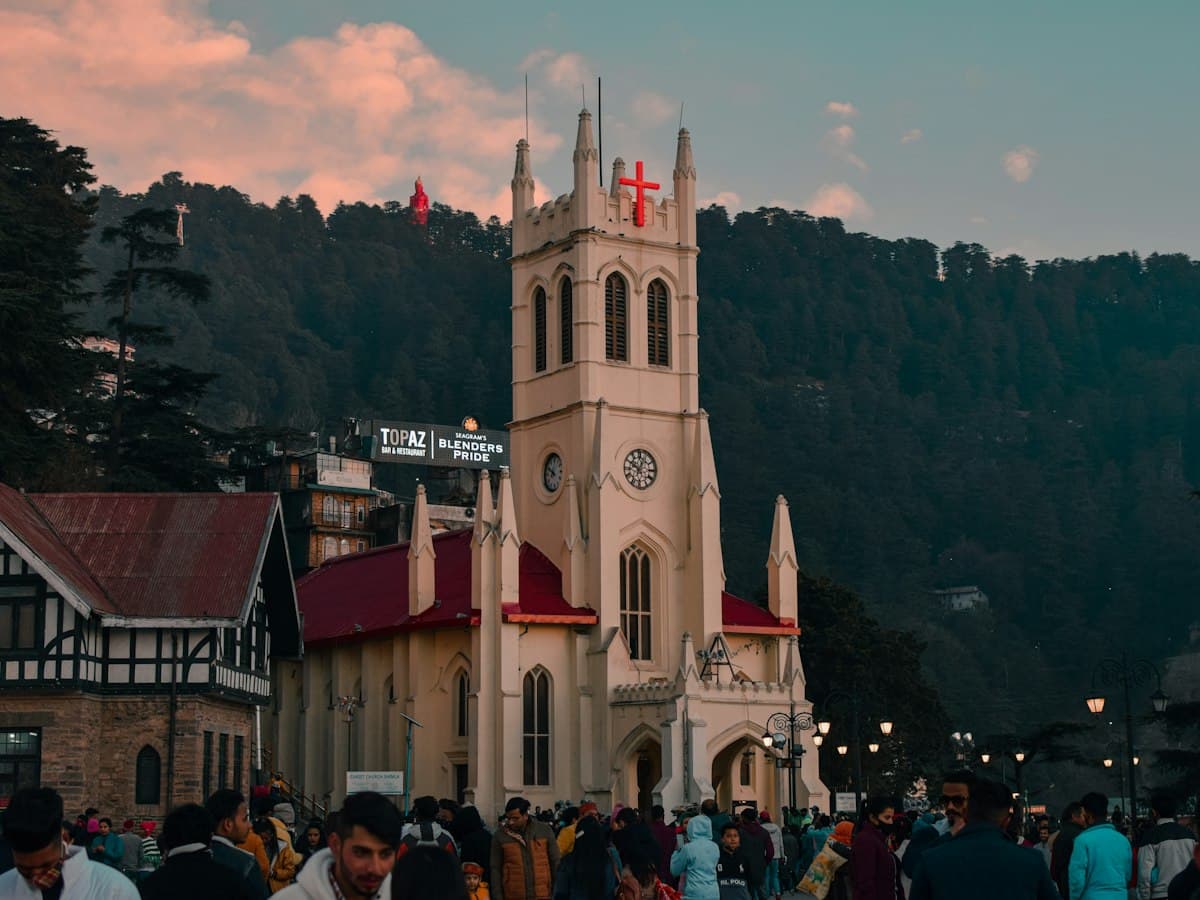 Crowds walk the open promenade beside Christ Church on The Ridge in Shimla.