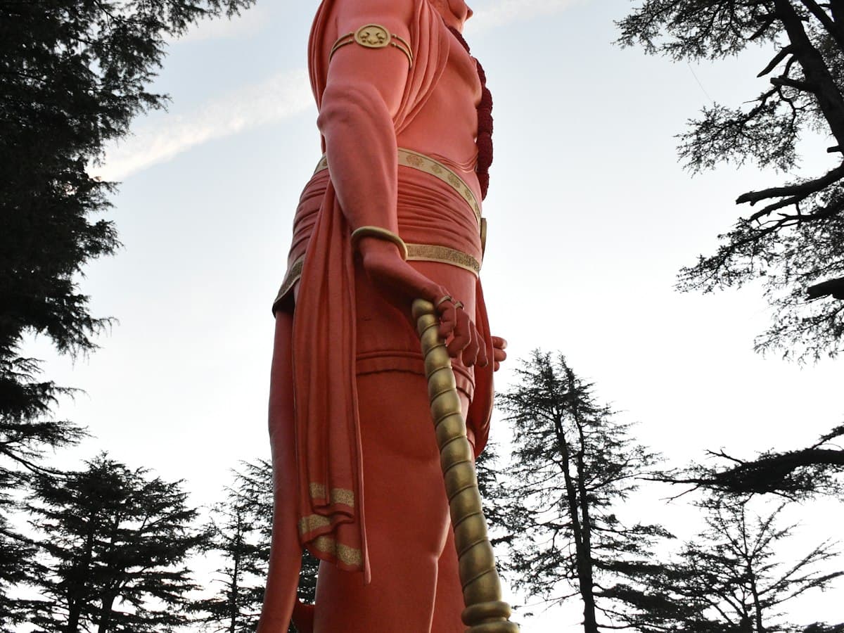 The towering Hanuman statue at Jakhu Temple rises above the forested hilltop over Shimla.
